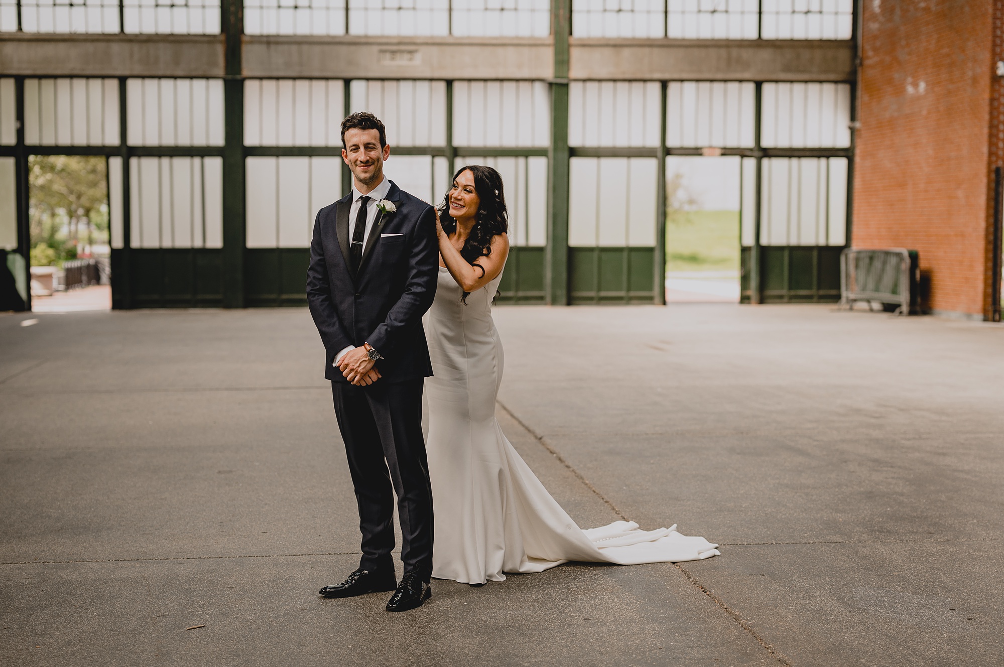 bride reaches for groom during first look at the Liberty House