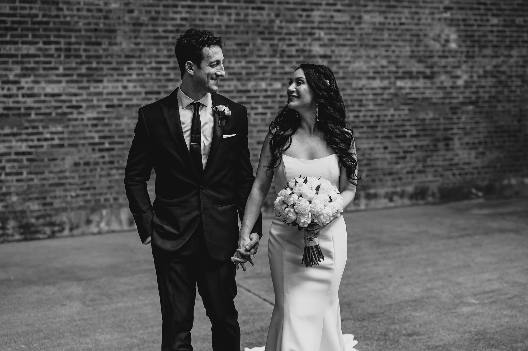 newlyweds walk outside the Liberty House
