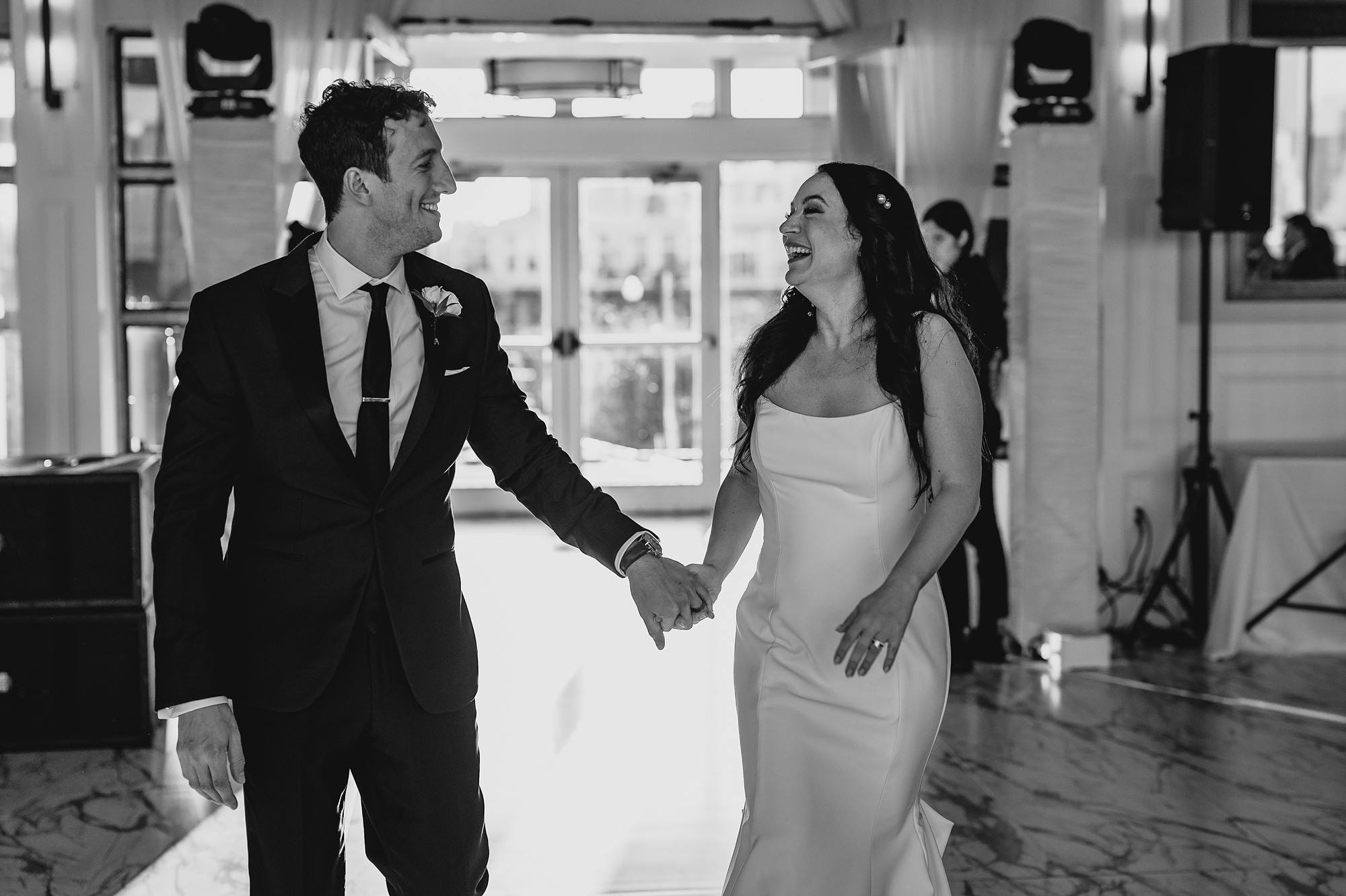 bride and groom smile at each other during reception at the Liberty House