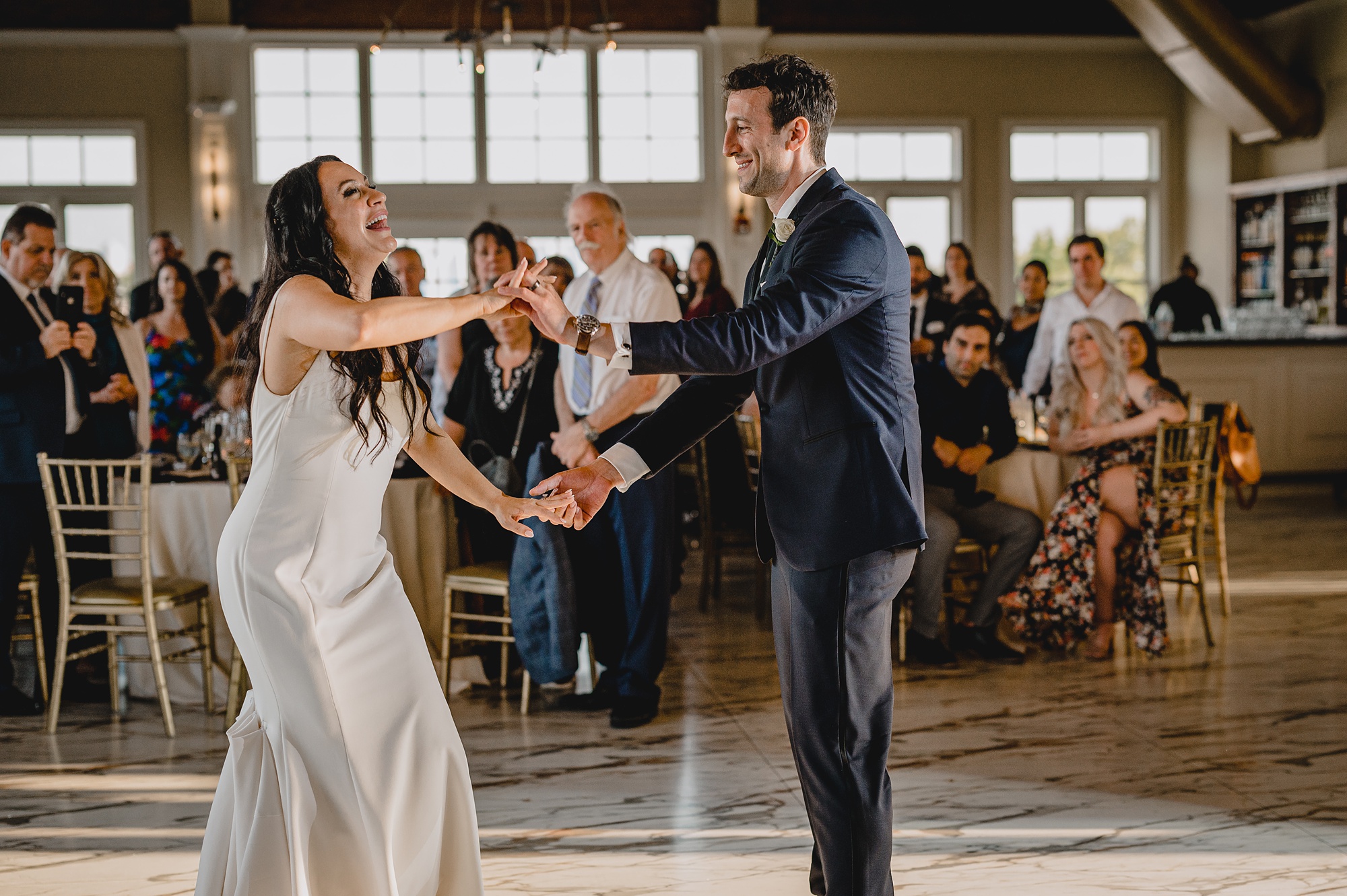 bride and groom laugh after first dance at the Liberty House