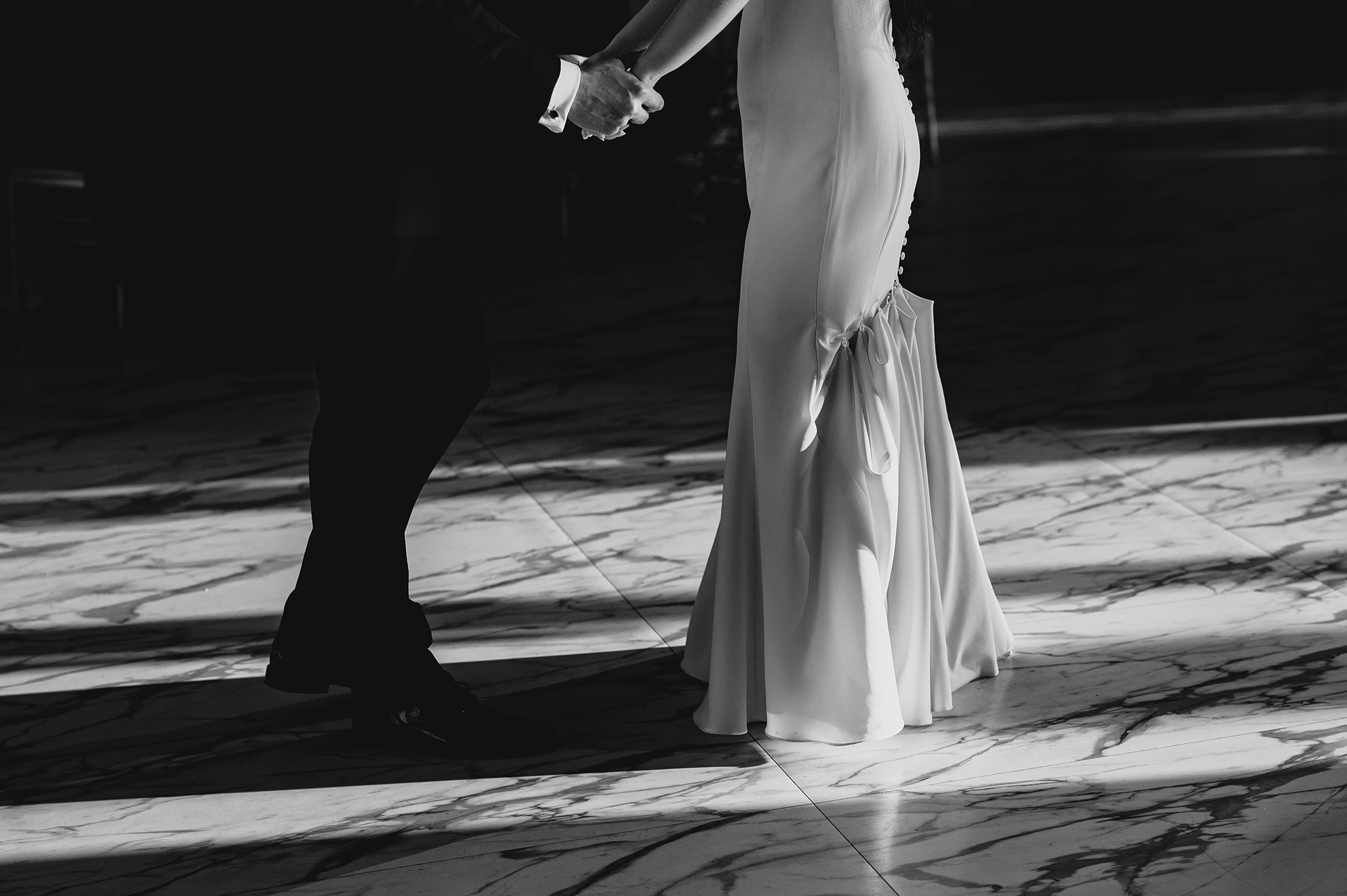 photo of the bottom of bride's wedding gown bustled up