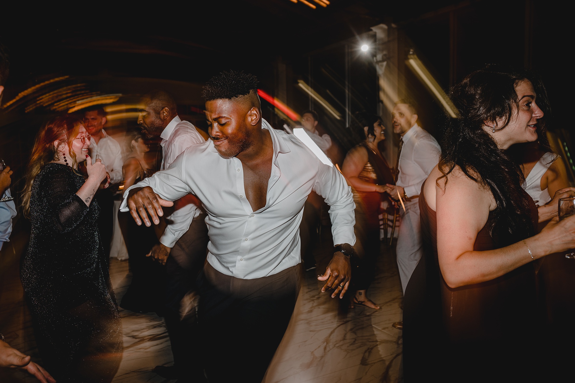 wedding guests dance during reception at the Liberty House