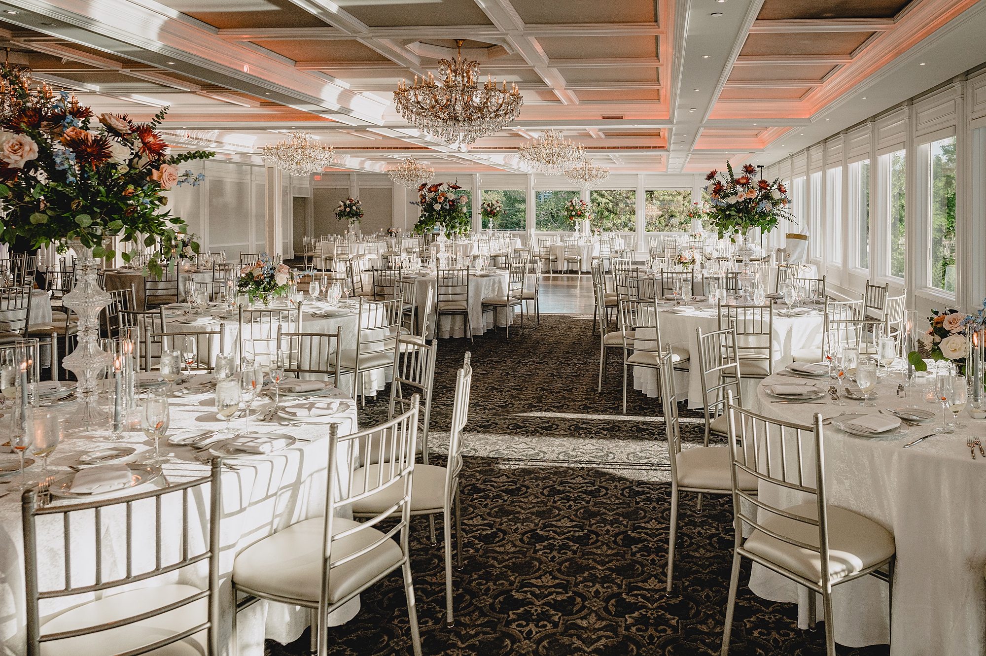fall wedding reception with pink and red florals at the Mill Lakeside Manor