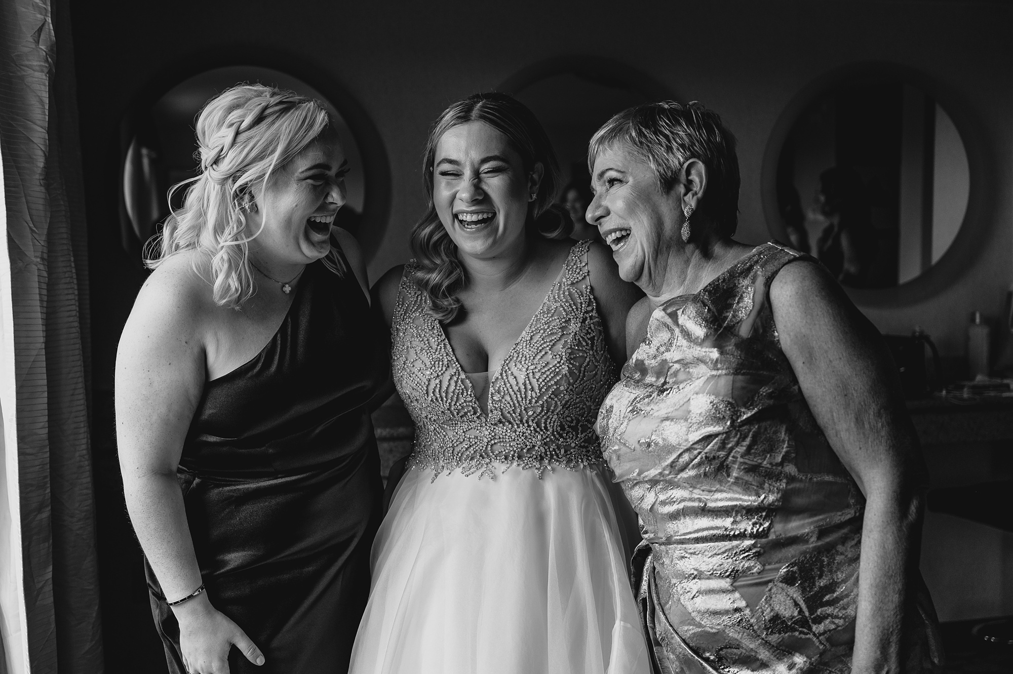 bride hugs mom and sister in Staten Island hotel