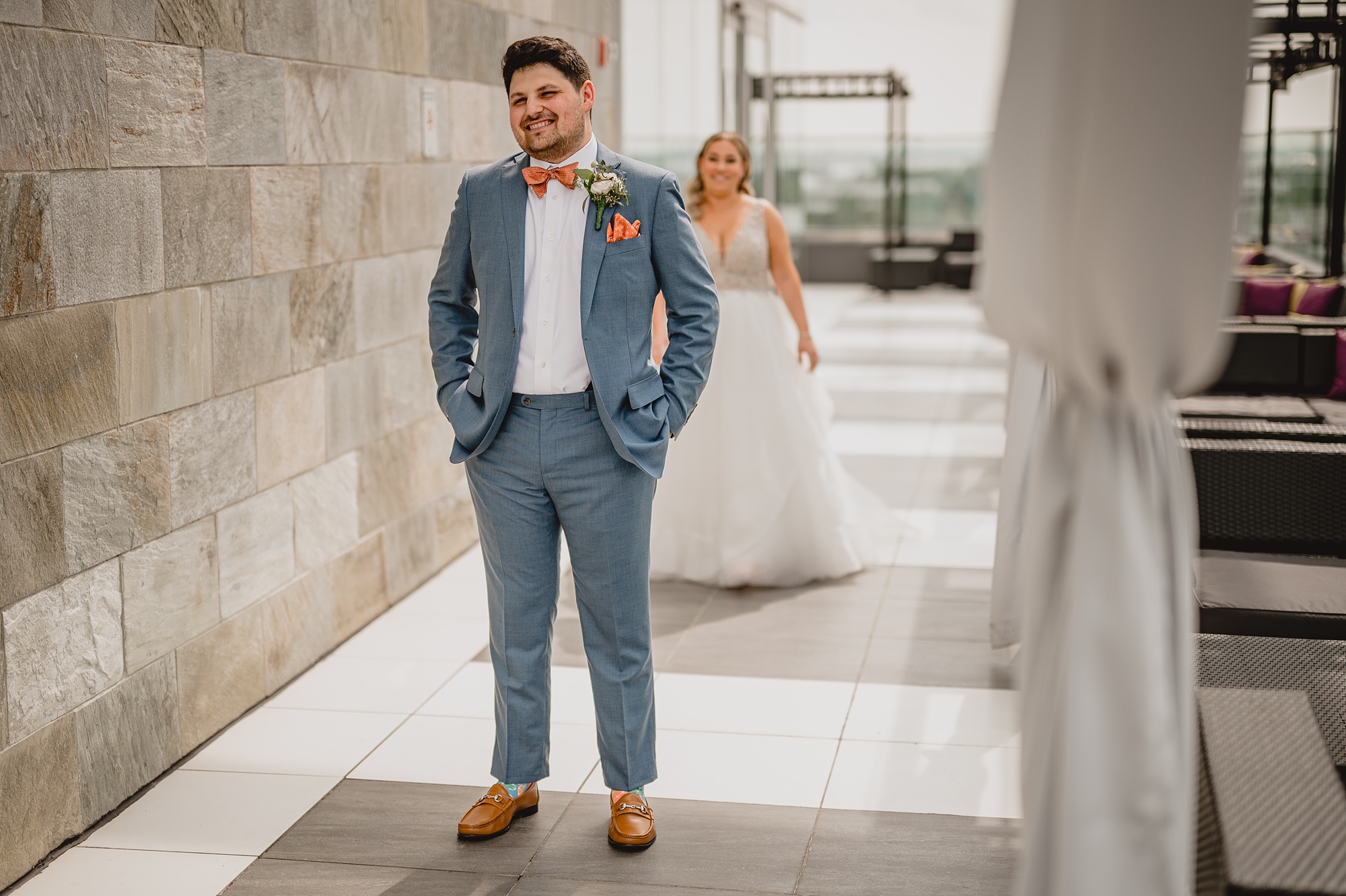 bride approaches groom for first look on rooftop of Above Staten Island