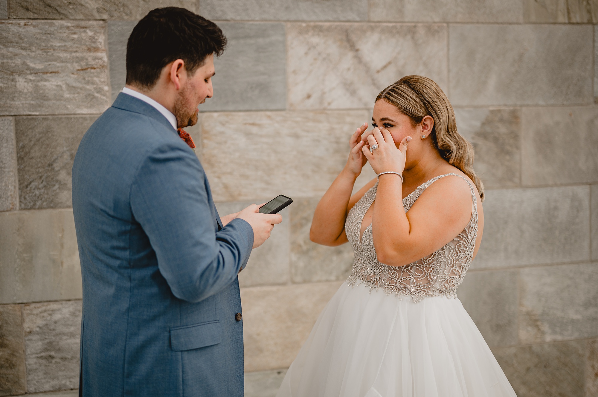 bride wipes tears from eyes during first look at Above Staten Island