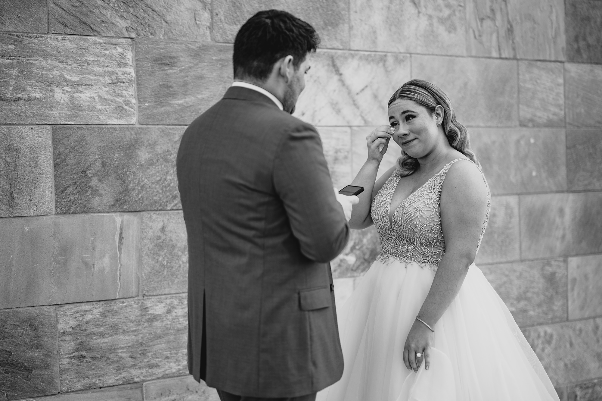 bride and groom cry during emotional first look at Above Staten Island