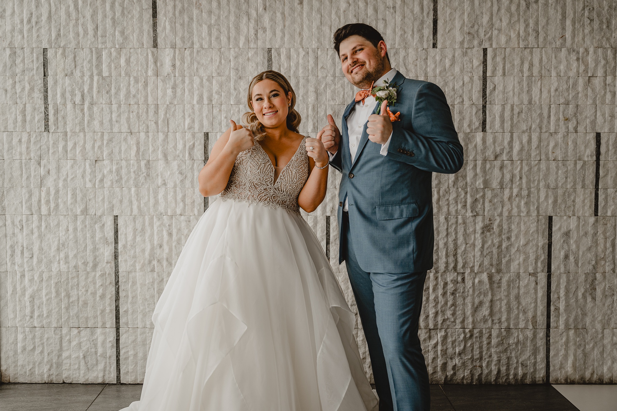 newlyweds dance during portraits outside Above Staten Island