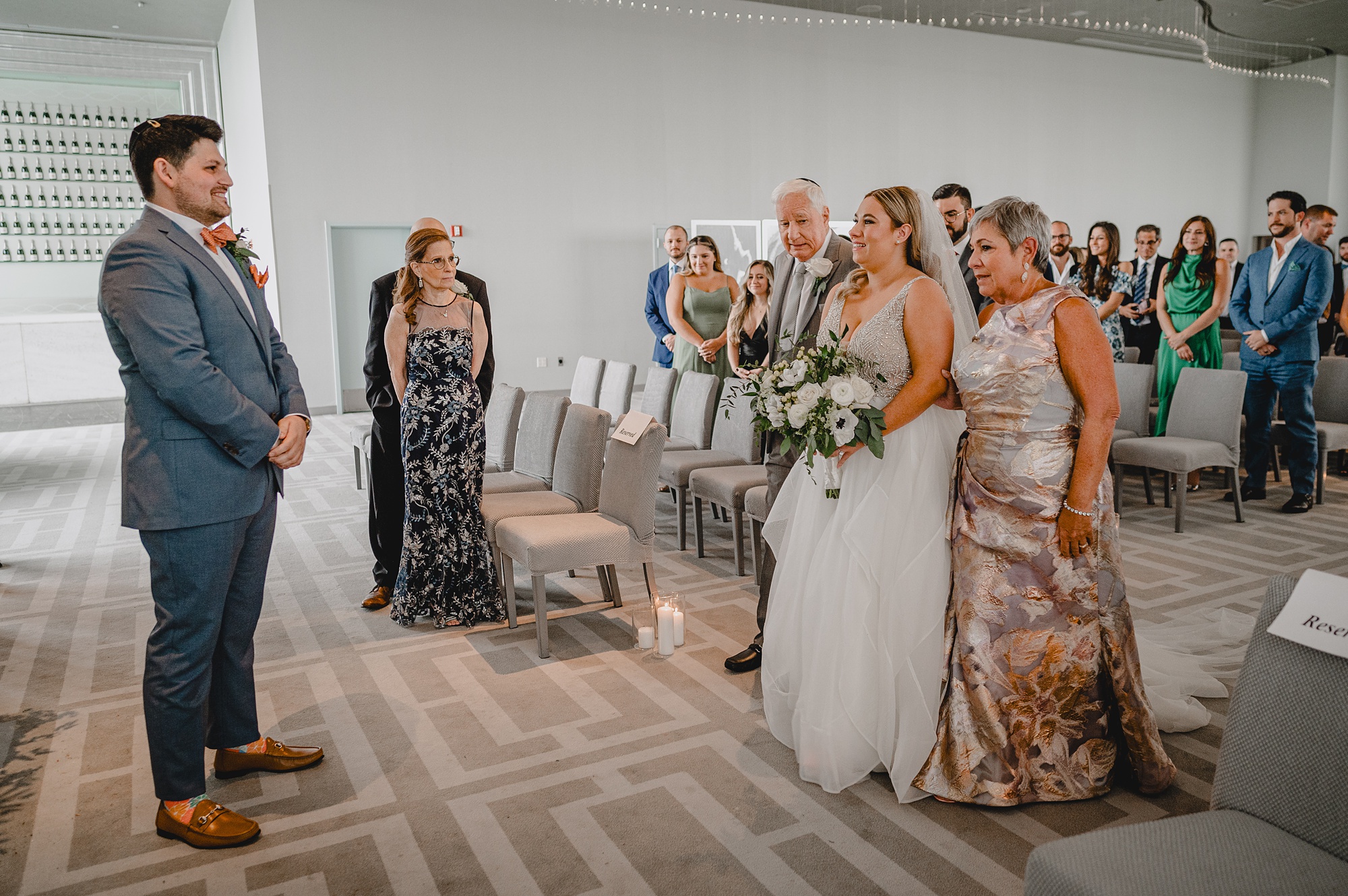 parents walk bride down aisle inside Above Staten Island