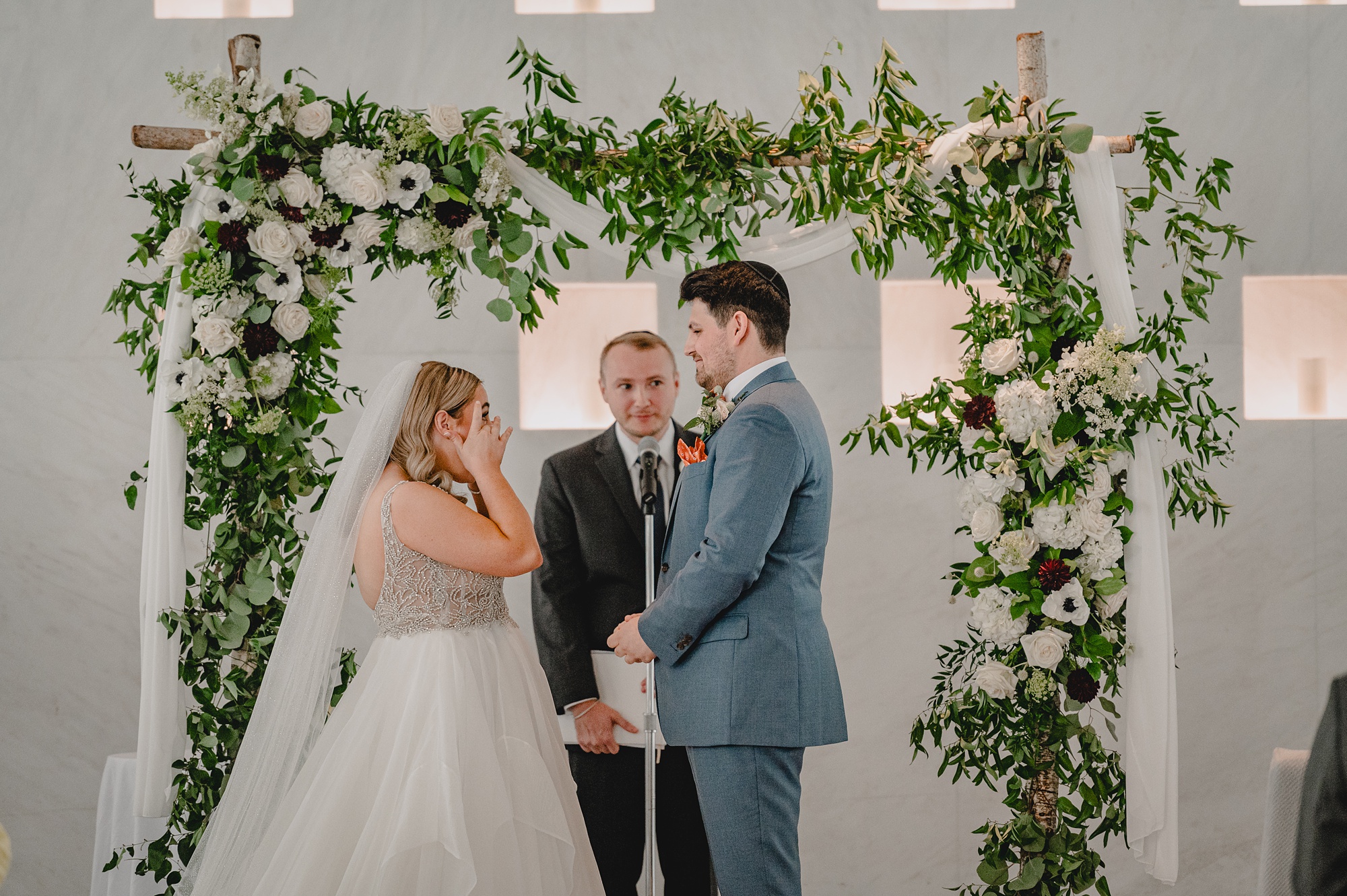 bride cries during wedding ceremony at Above Staten Island