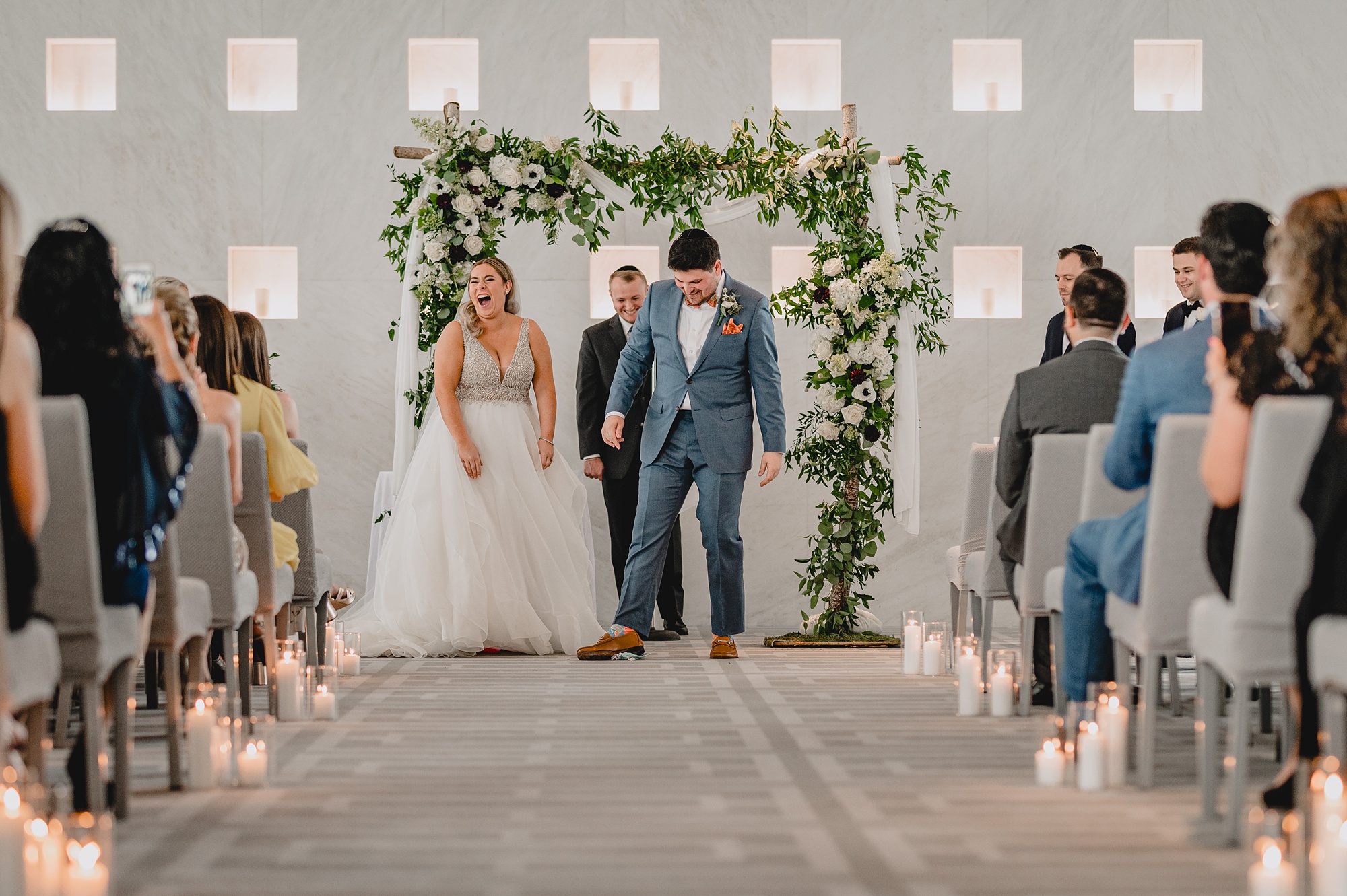 groom breaks glass during wedding ceremony
