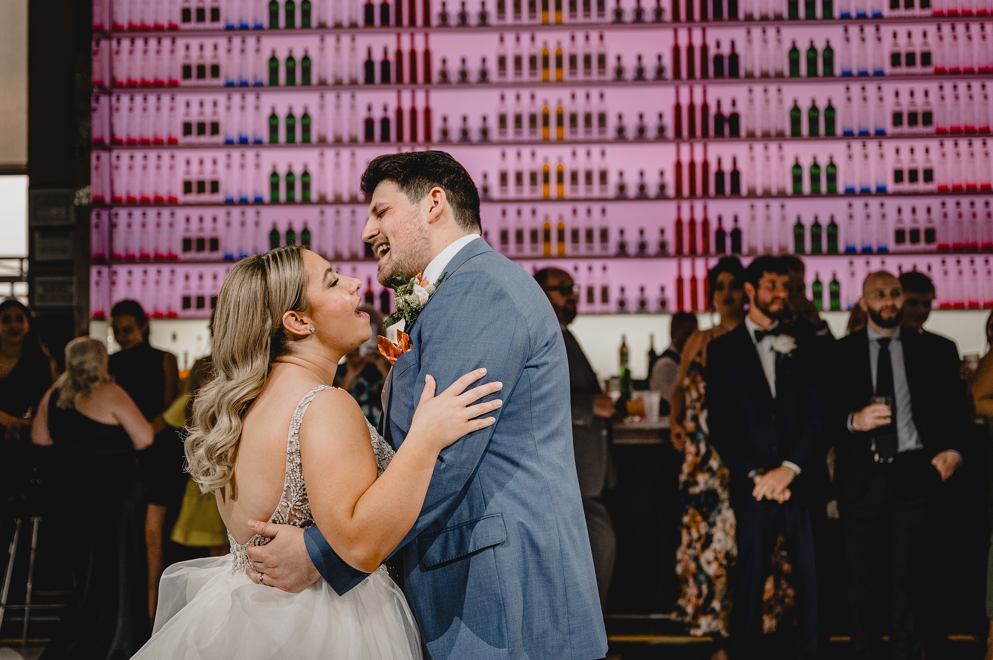 bride and groom laugh dancing during recpeiont at Above Staten Island