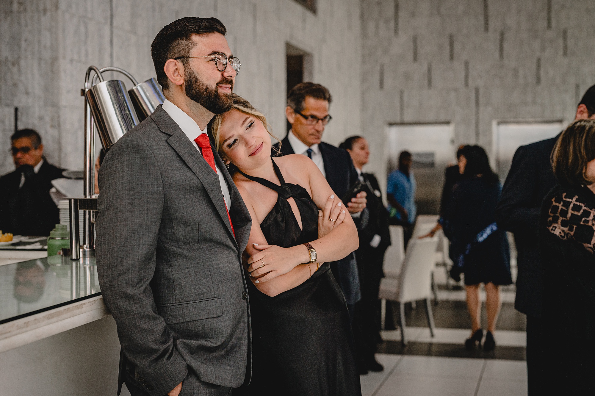 guests hug leaning together on the edge of the dance floor
