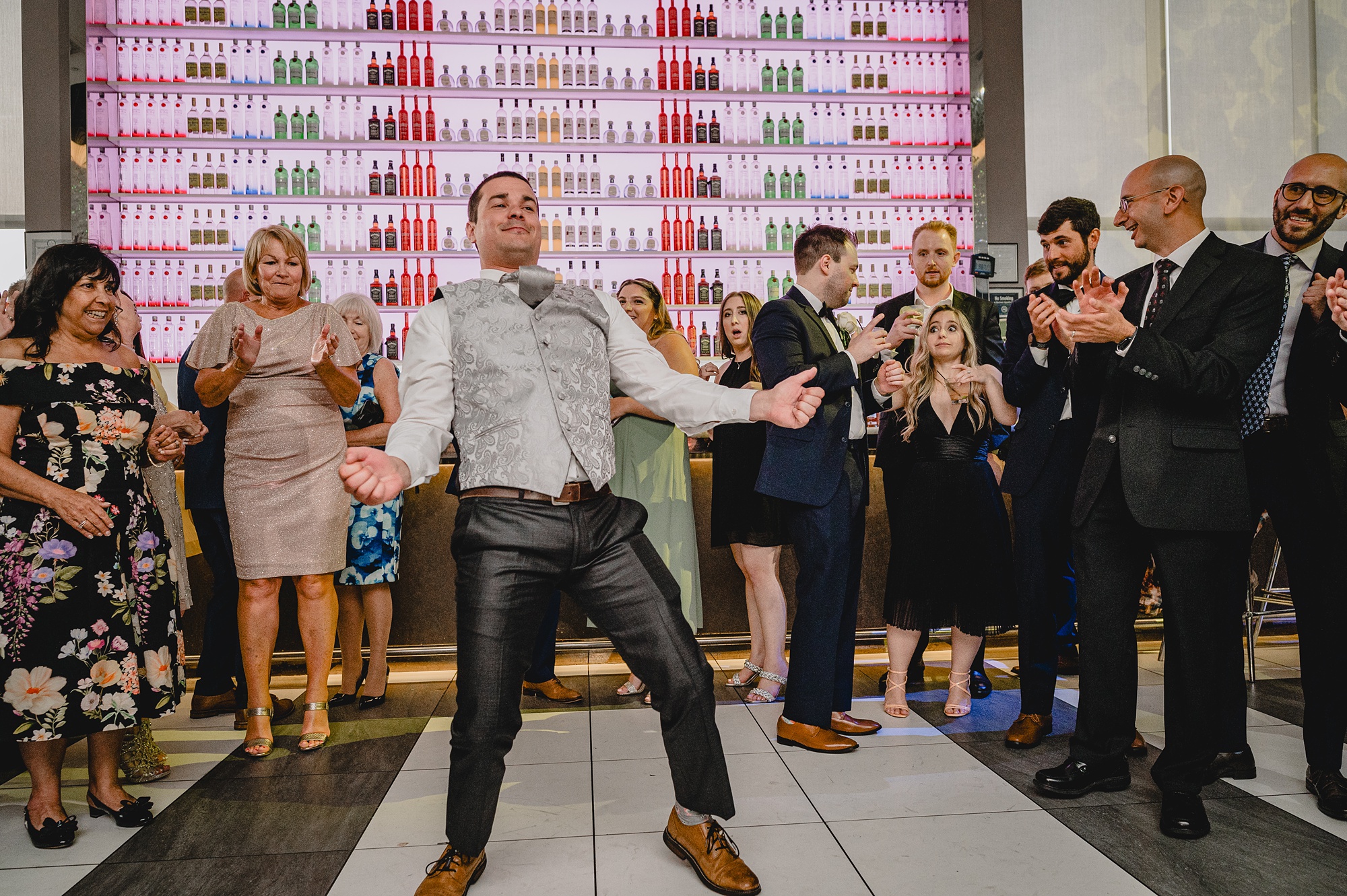man shimmies on dance floor during reception at Above Staten Island