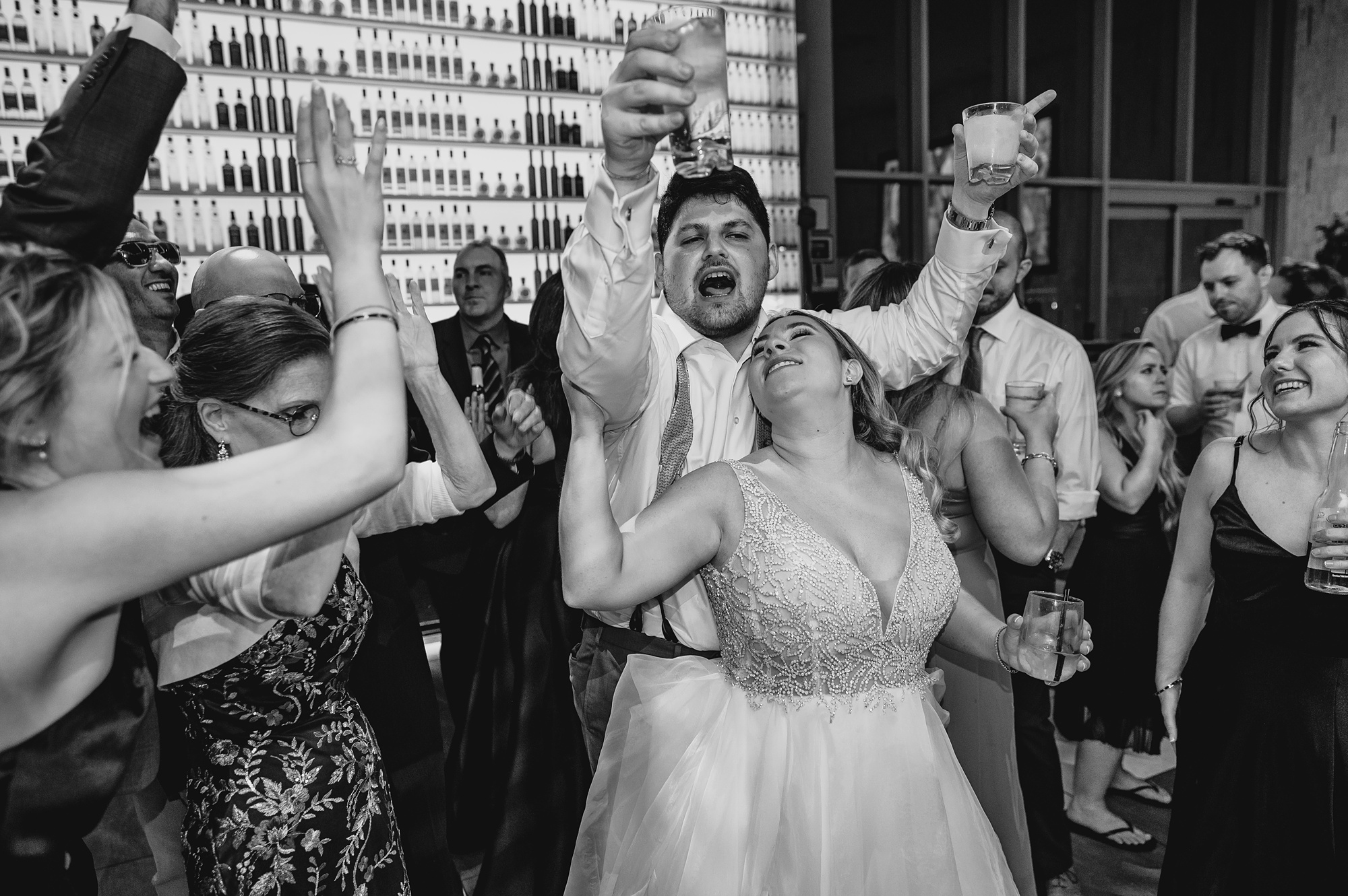 bride and groom party with wedding guests during NY reception