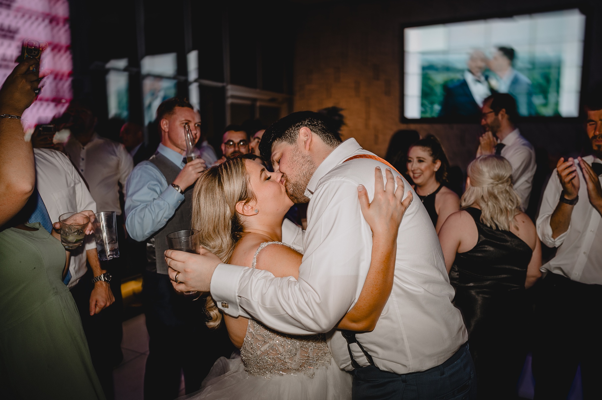 newlyweds kiss on dance floor at Above Staten Island