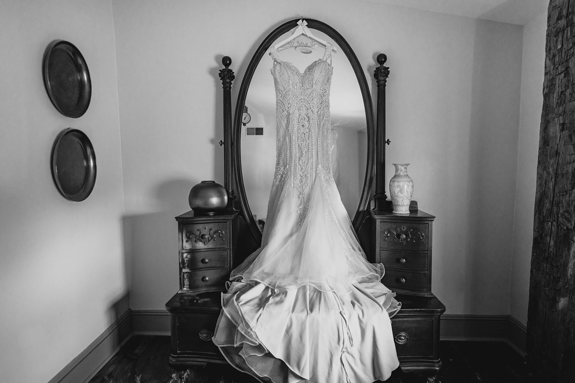 wedding dress hangs on mirror in suite at David's Country Inn