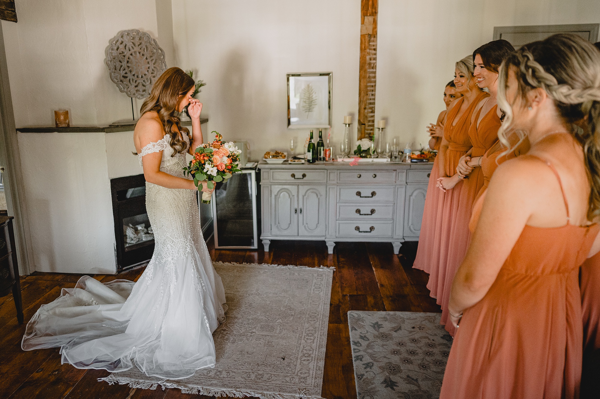 bride cries during first look with bridesmaids at David's Country Inn