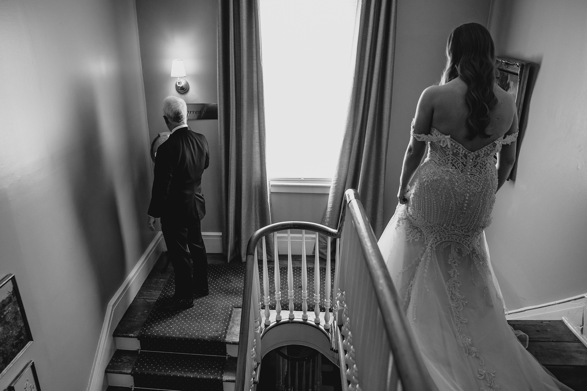 bride walks down staircase inside David's Country Inn