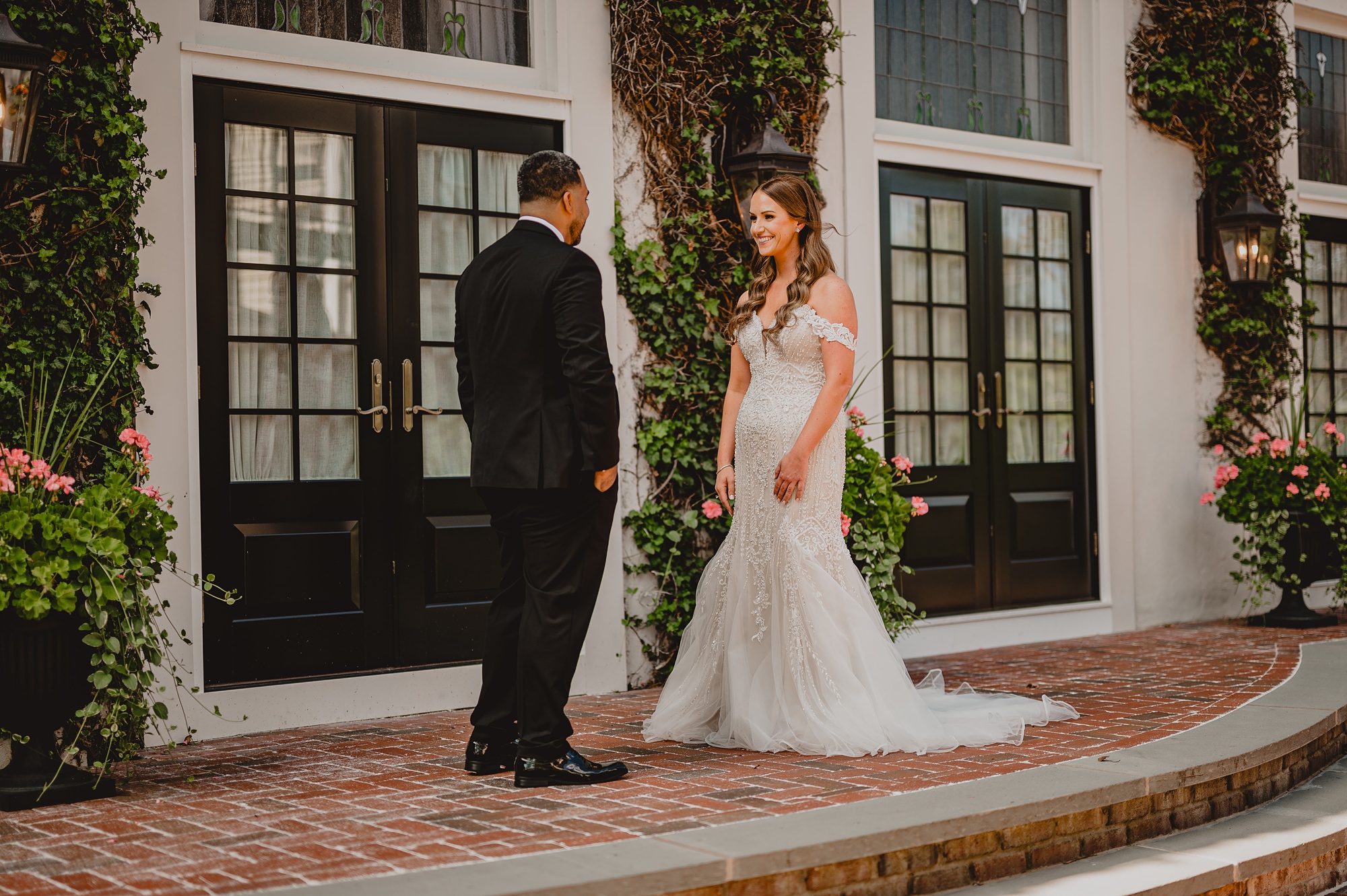 bride and groom face each other during first look at David's Country Inn