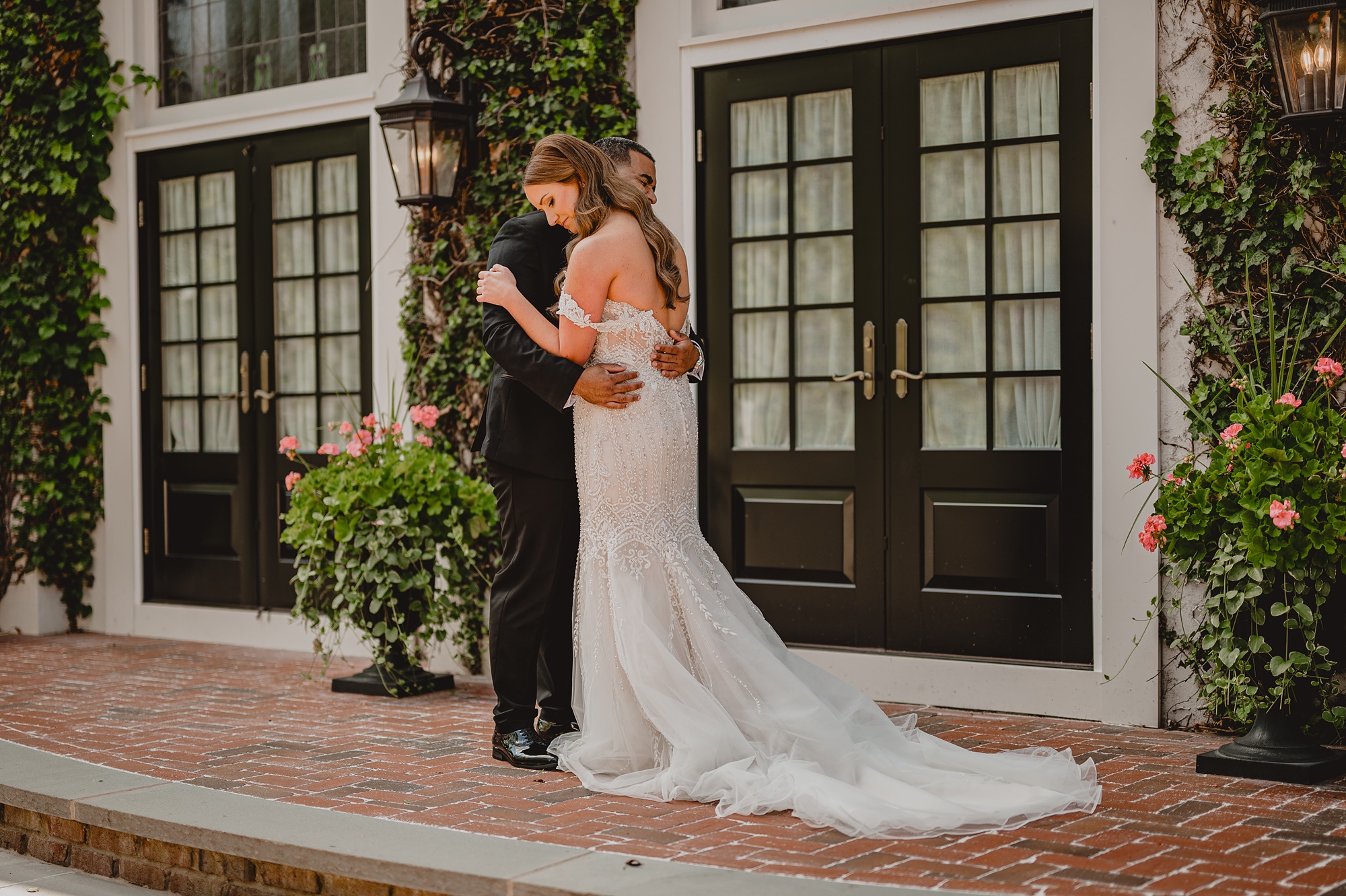 bride hugs groom leaning her head on his shoulder