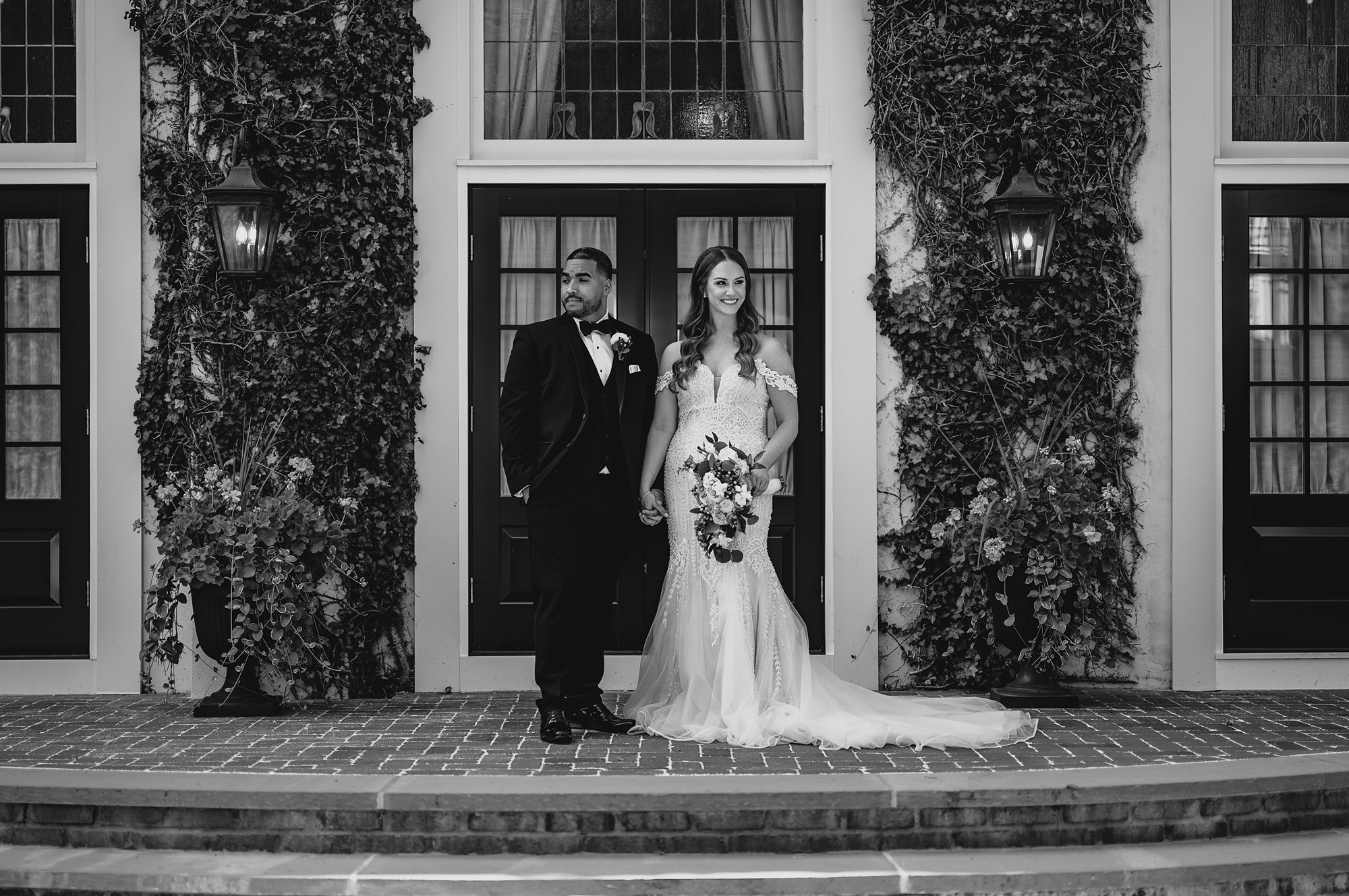 newlyweds hold hands looking opposite directions at David's Country Inn