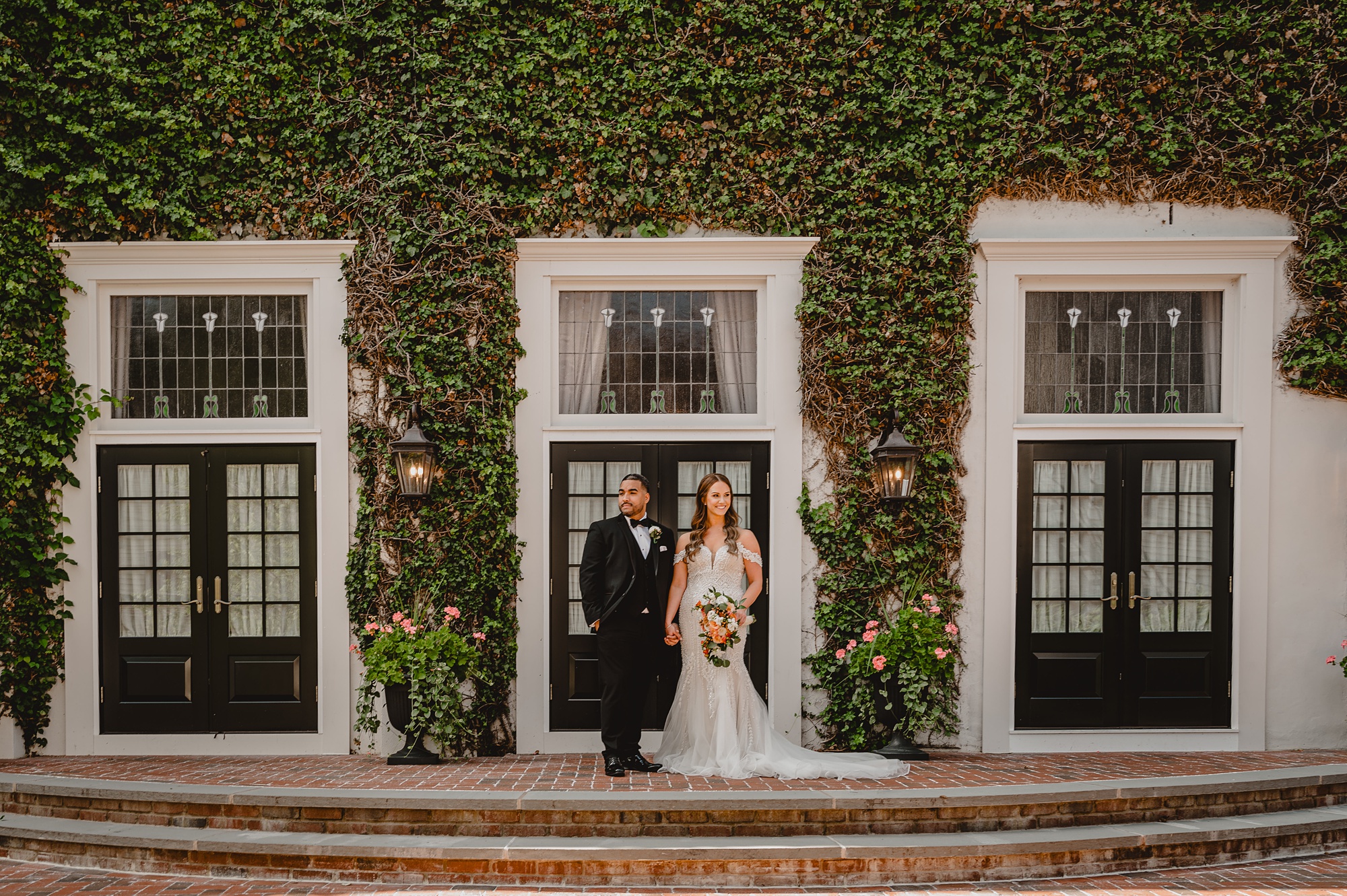 bride and groom stand on brick patios at David's Country Inn