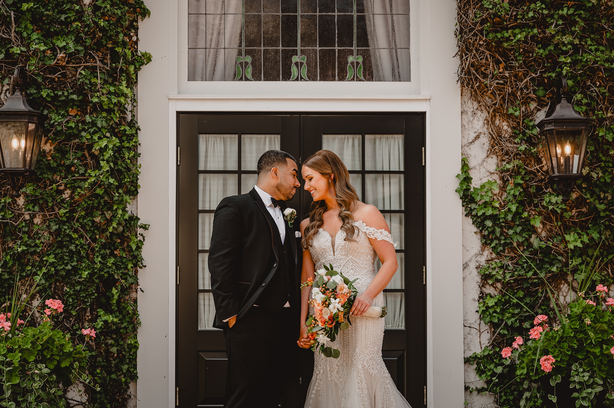 newlyweds hug leaning heads together during NJ wedding day