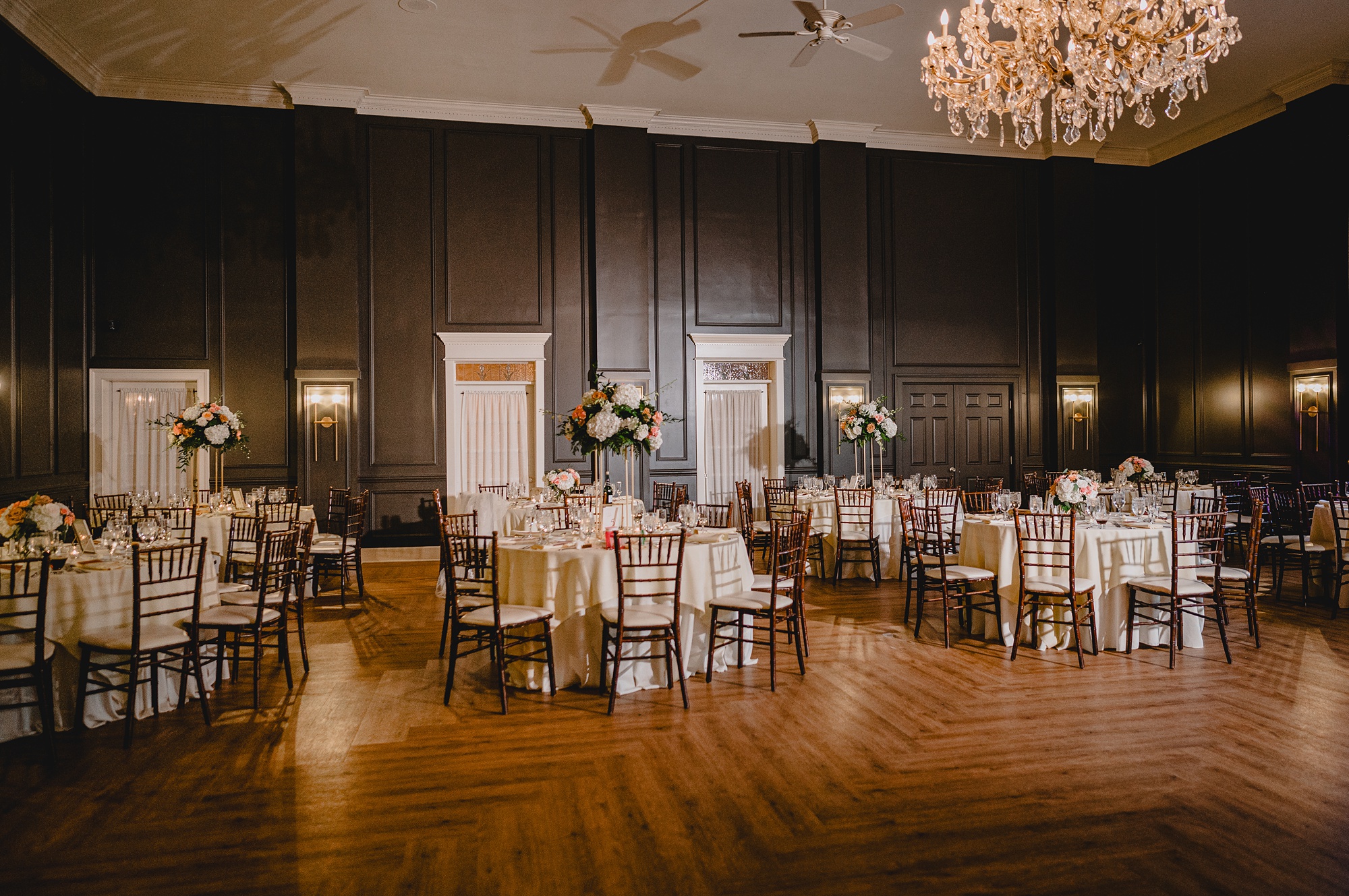wedding reception with pink and white flowers in ballroom of David's Country Inn