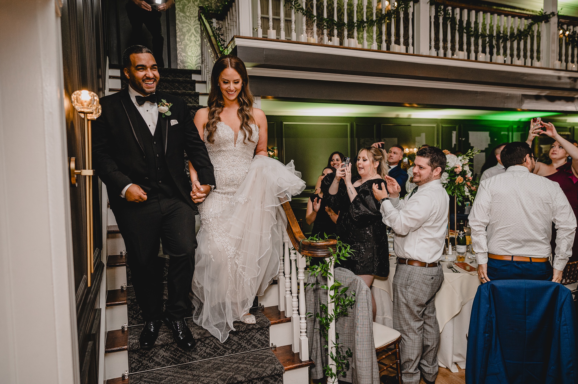 bride and groom walk down steps at David's Country Inn