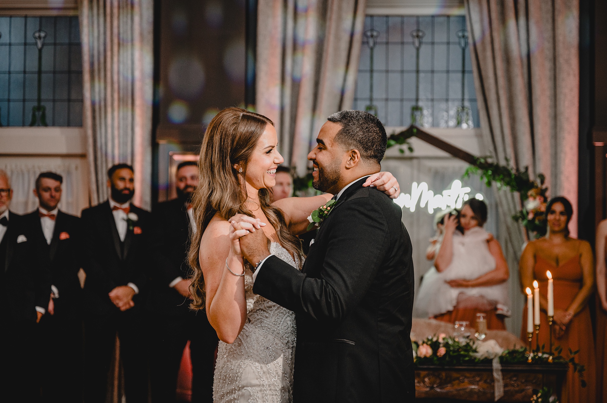 bride and groom hug on dance floor at David's Country Inn