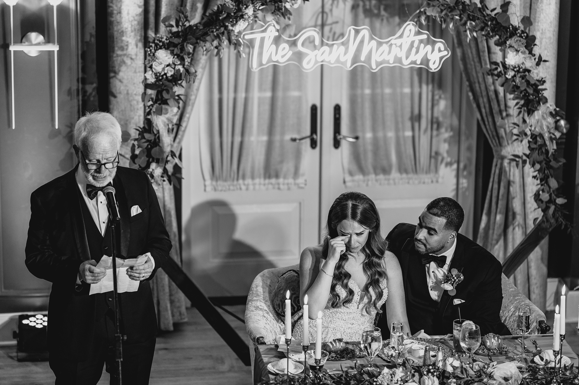bride wipes away tear during speeches at Hackettstown NJ wedding reception