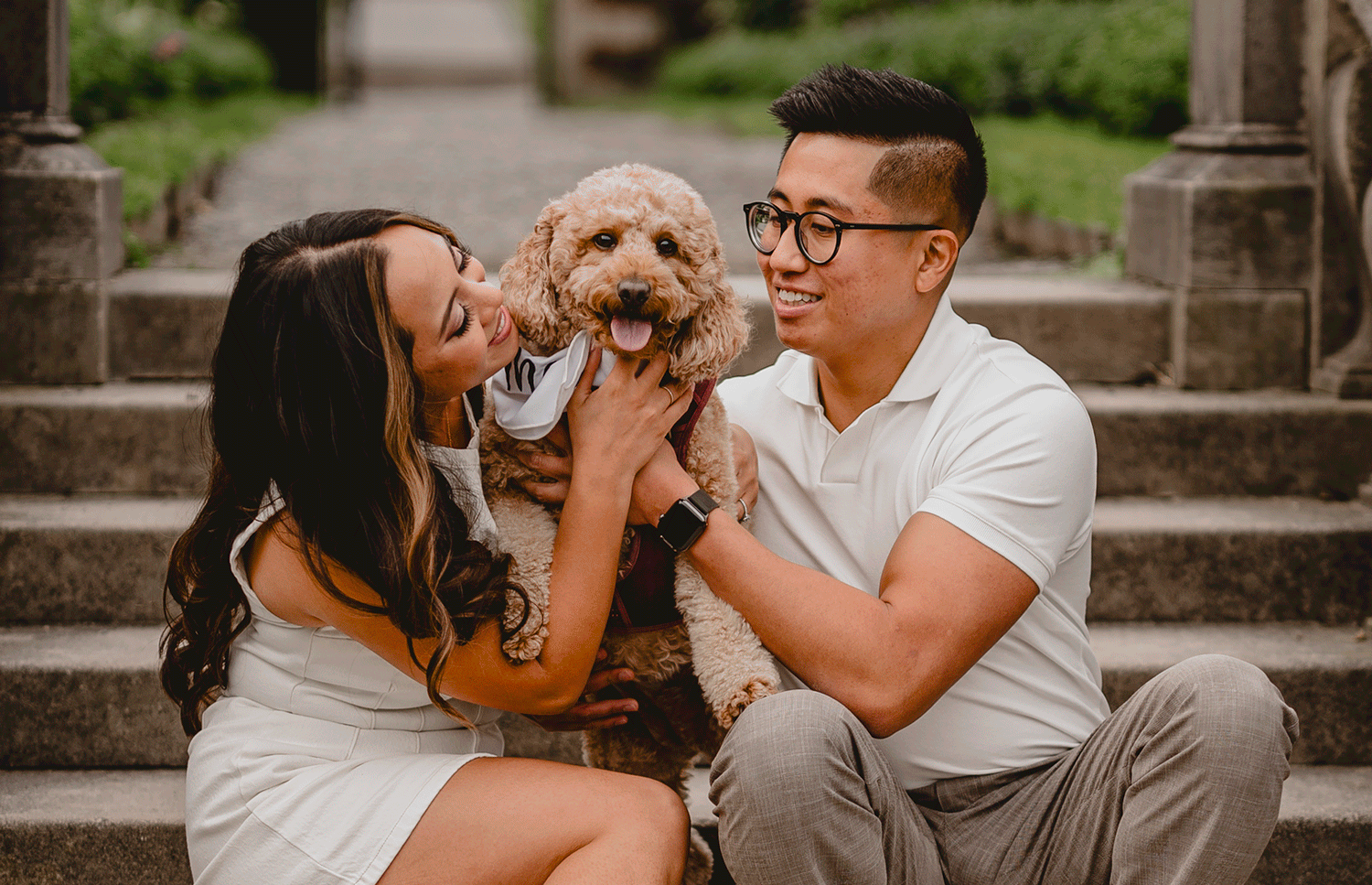 couple pet dog sitting on brick steps at Old Westbury Gardens
