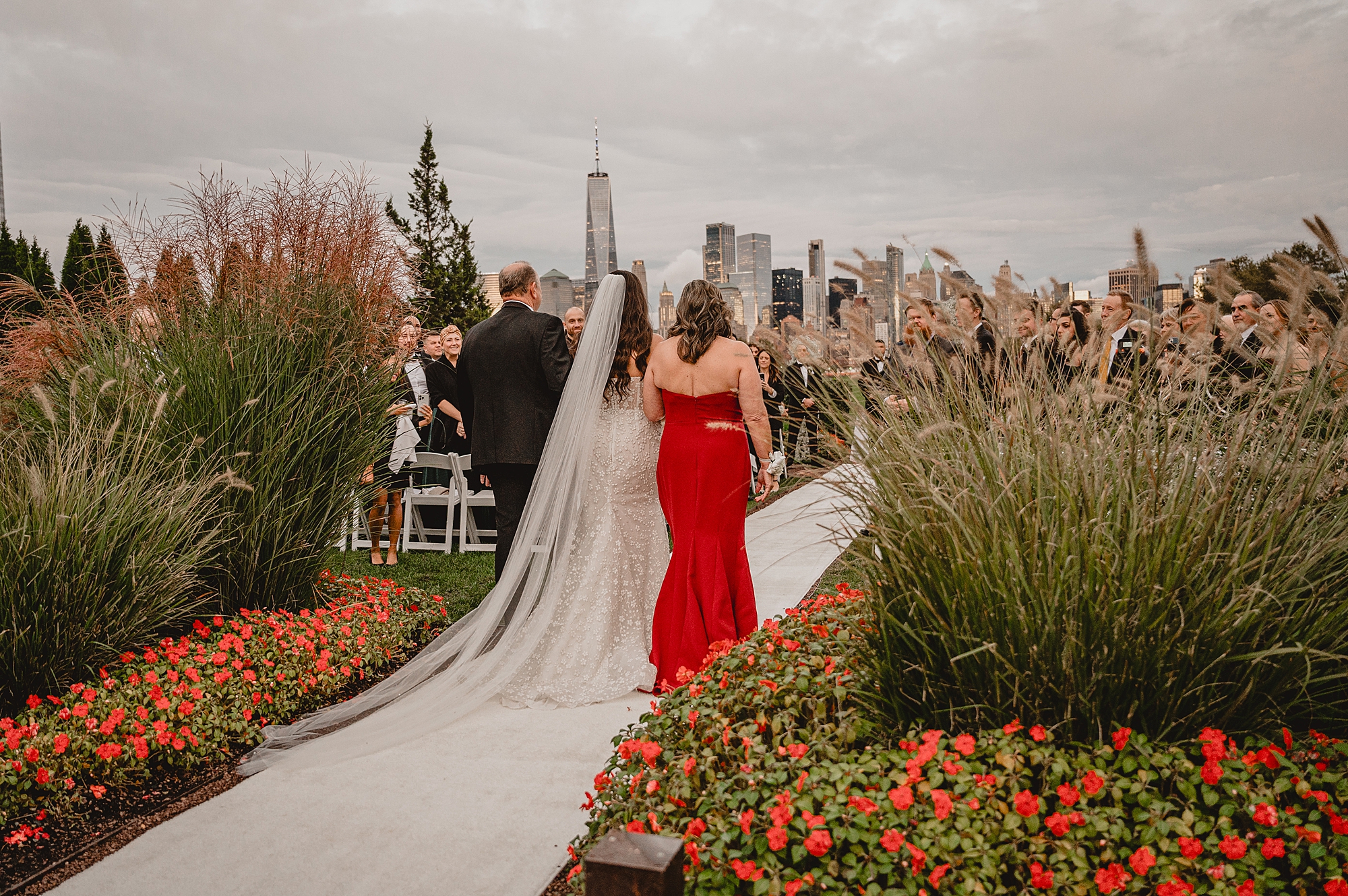 mother and father escort bride down aisle for the Liberty House wedding ceremony