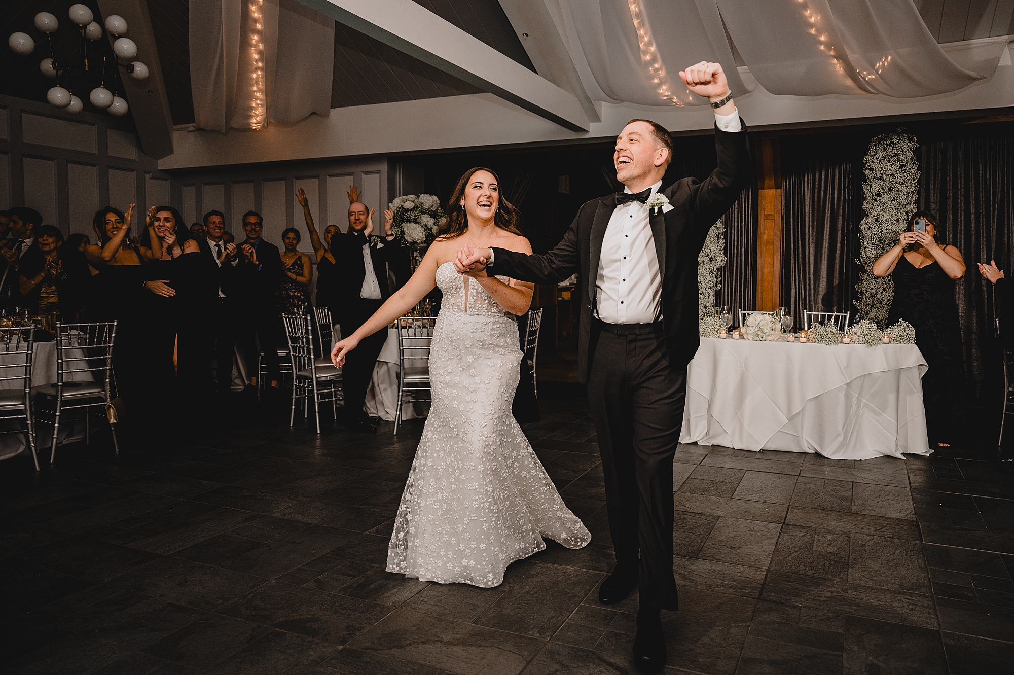 newlyweds cheer on dance floor of Jersey City hotel