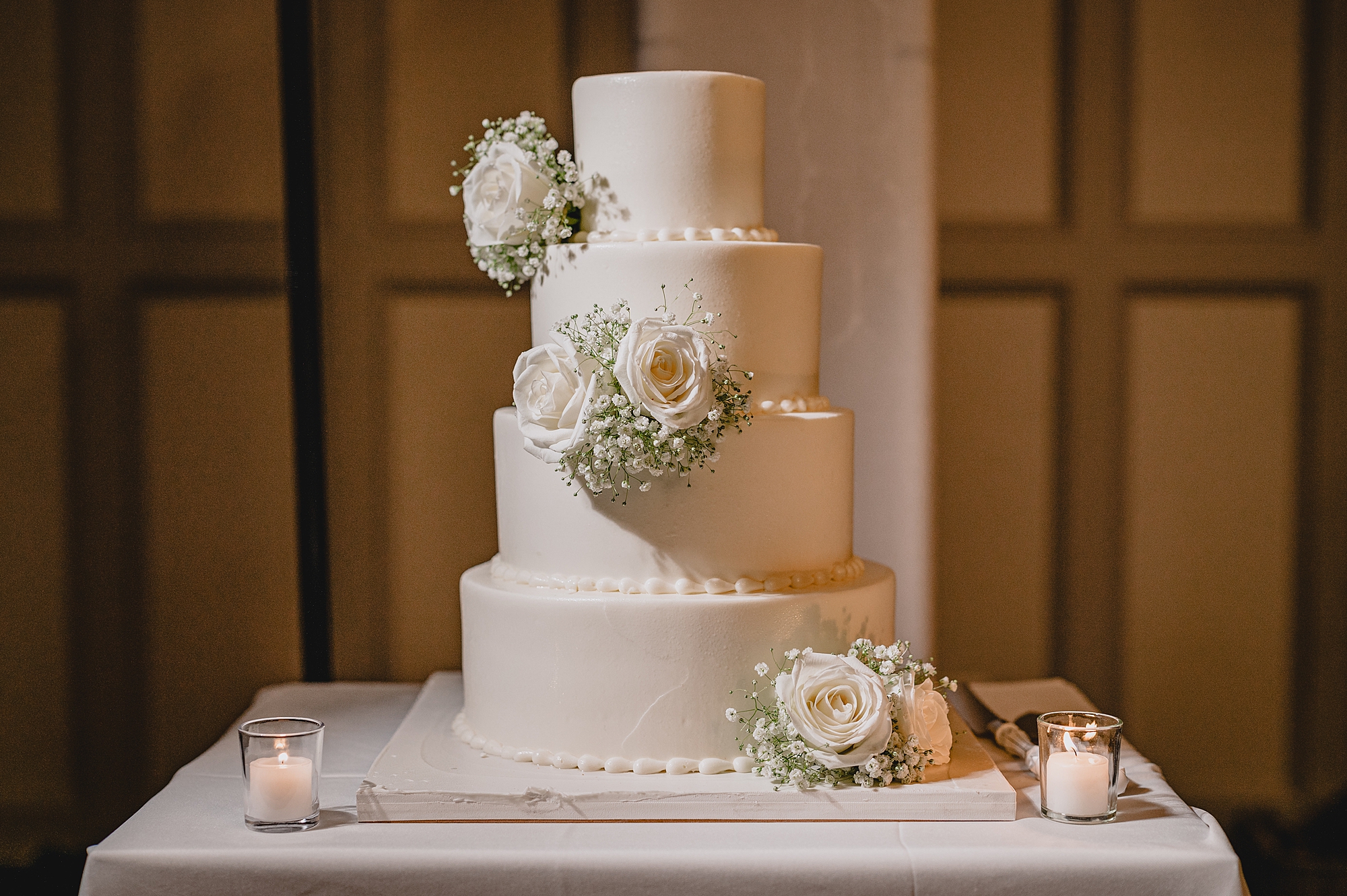 tiered wedding cake with white roses
