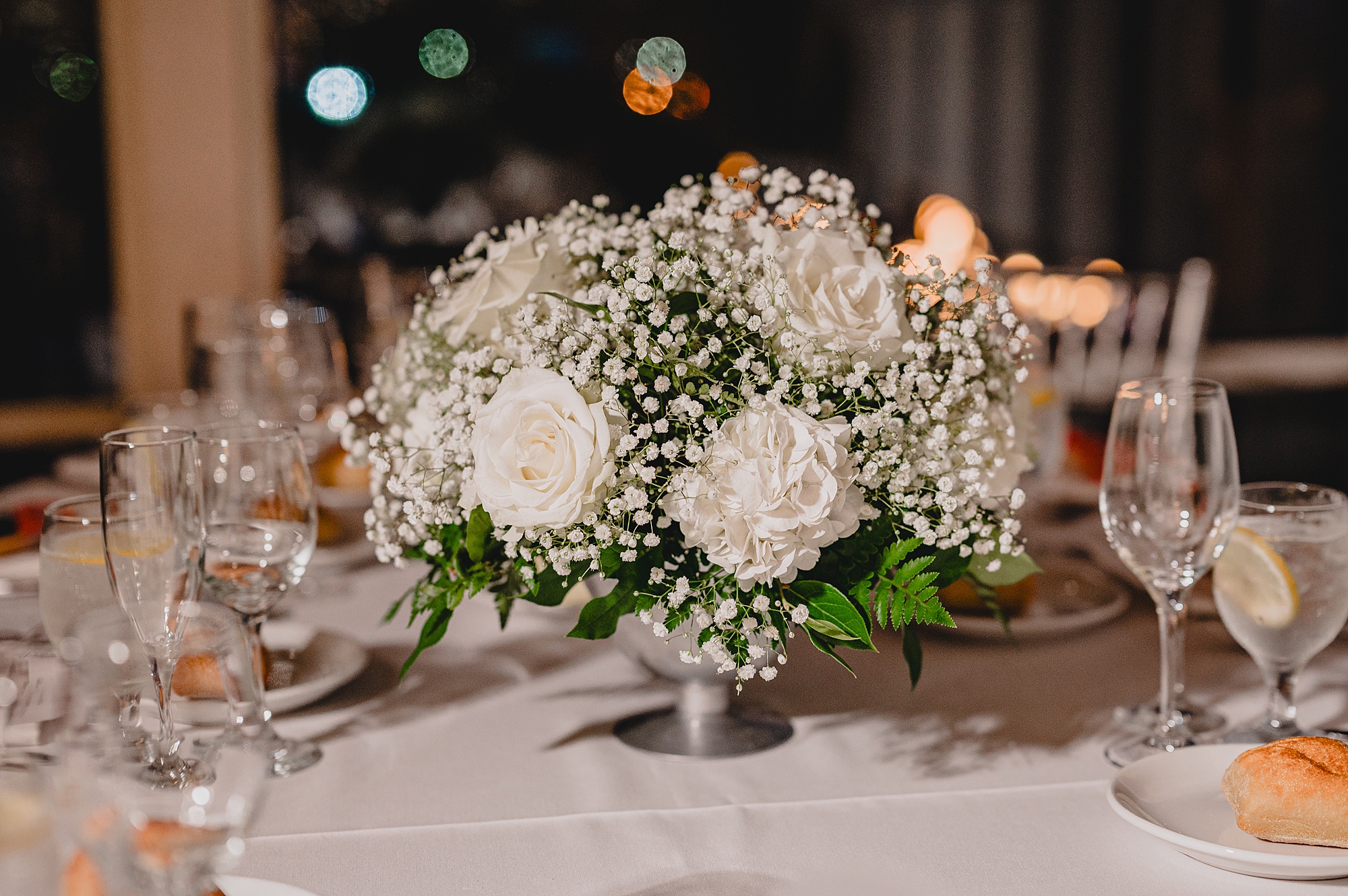 white rose centerpiece with baby's breath at the Liberty House