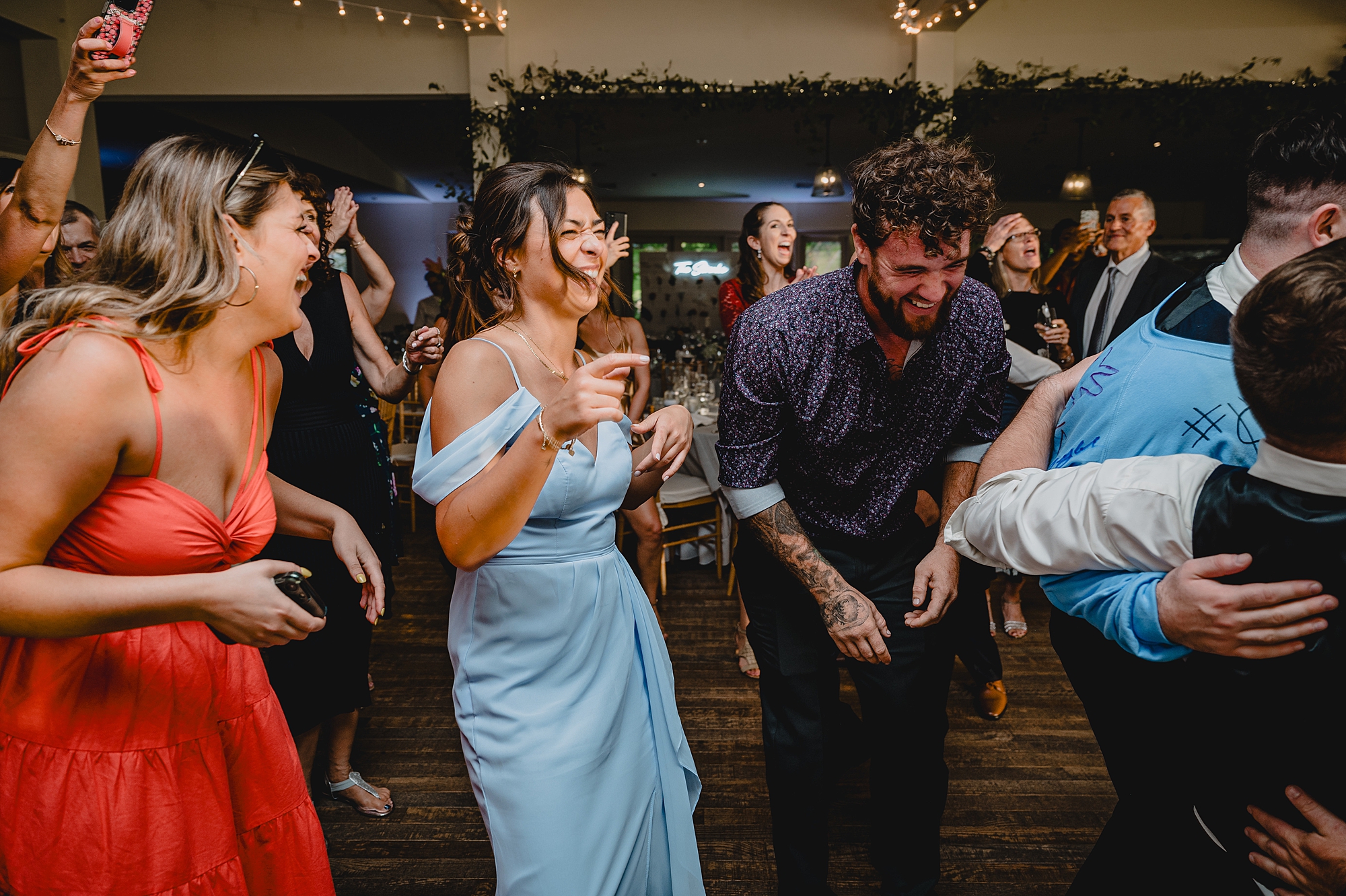 wedding guests dance during wedding reception at the Garrison