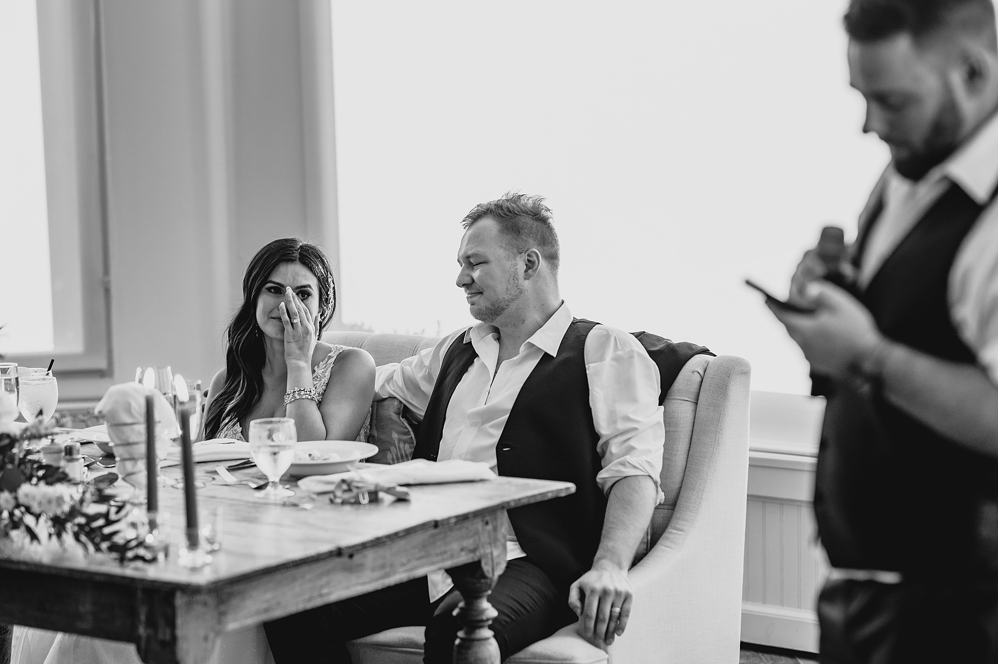 newlyweds listen to toasts during wedding reception at the Garrison