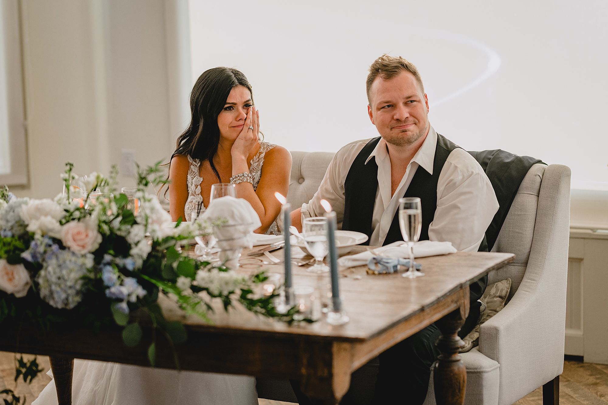 newlyweds listen to toasts during wedding reception at the Garrison