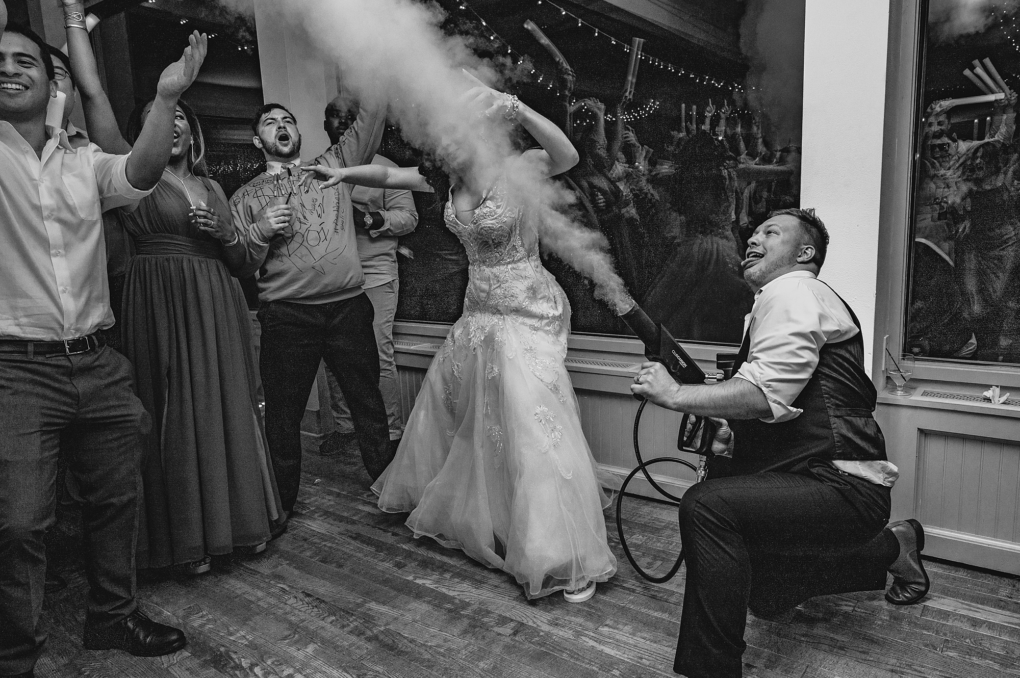 guests play with smoke machine during New York wedding reception