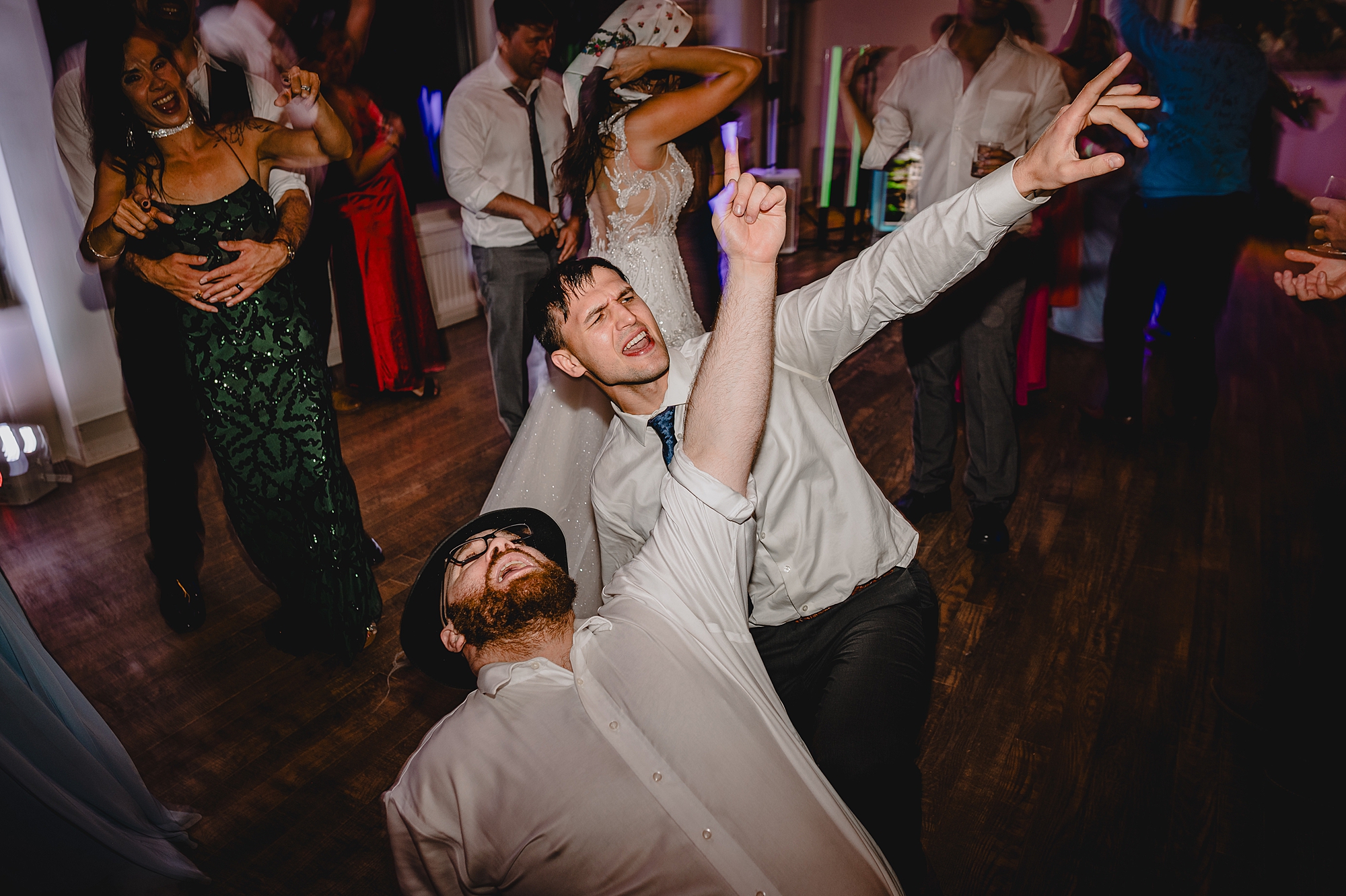 guests dance with glow sticks during NY wedding reception
