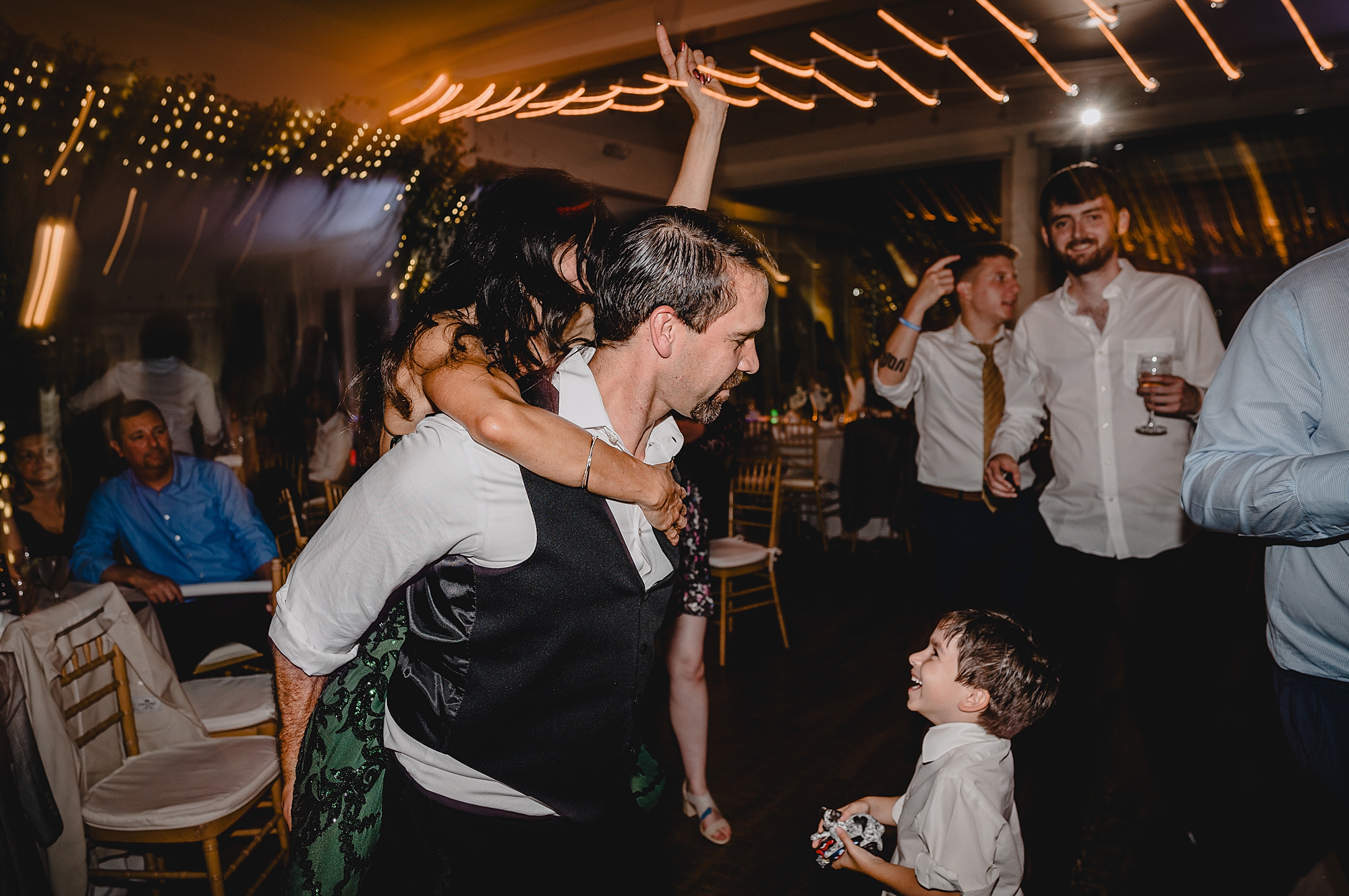 guests dance with glow sticks during NY wedding reception