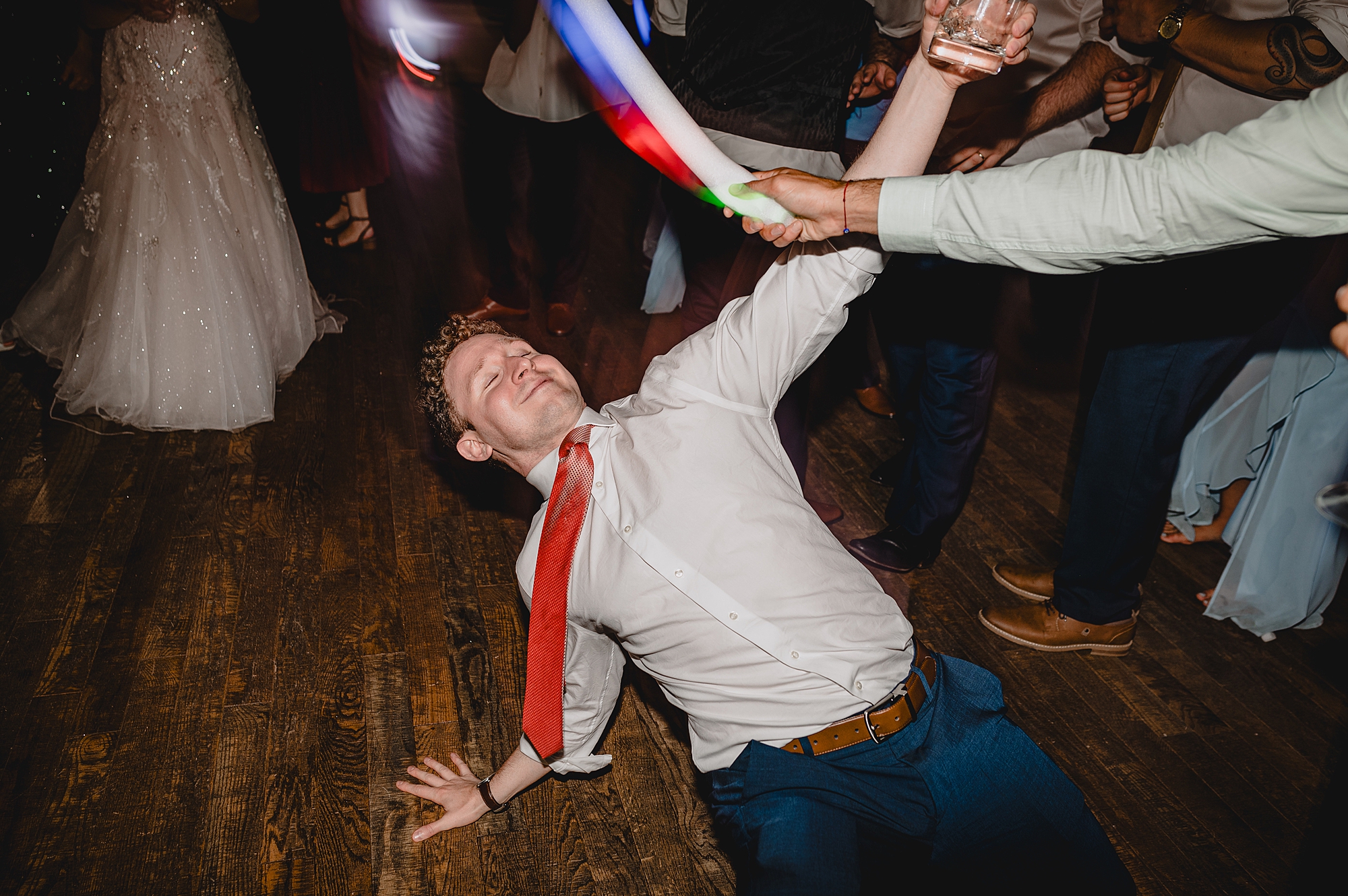 guests dance with glow sticks during NY wedding reception