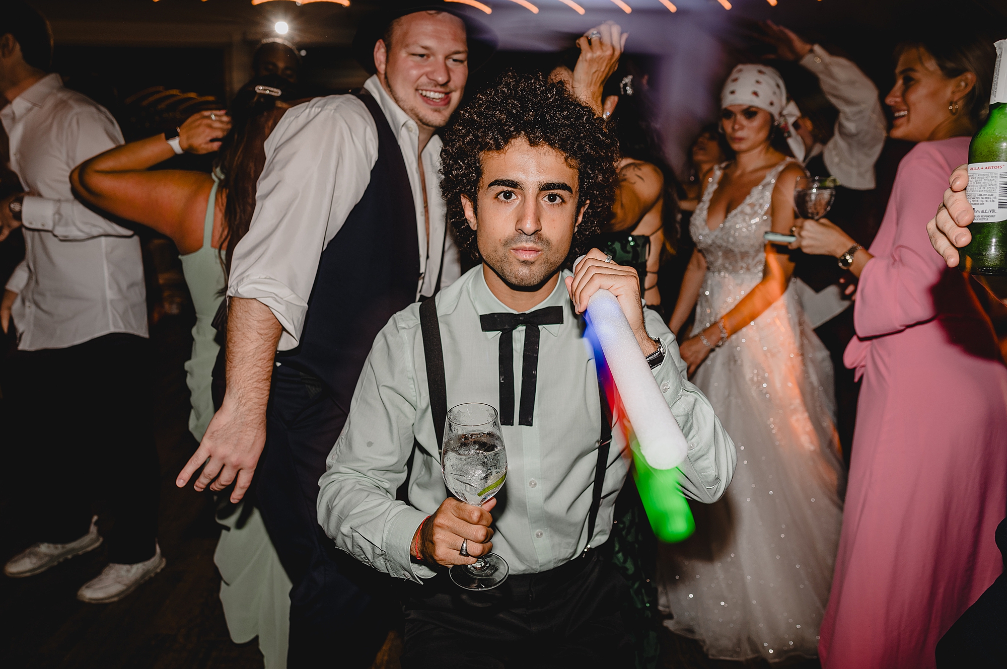 guests dance with glow sticks during NY wedding reception