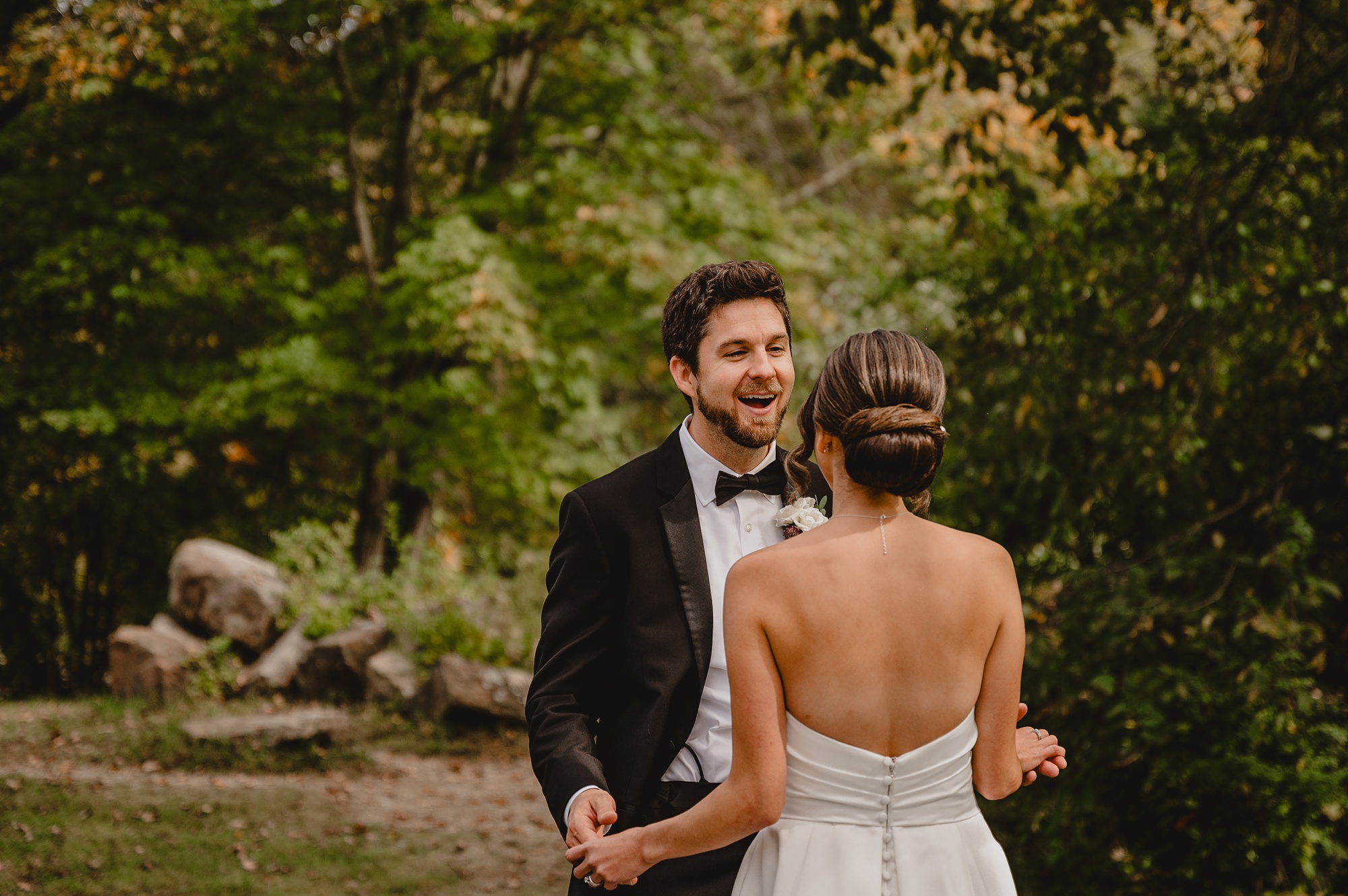 groom grins turning bride to see him during first look at Waterloo Village