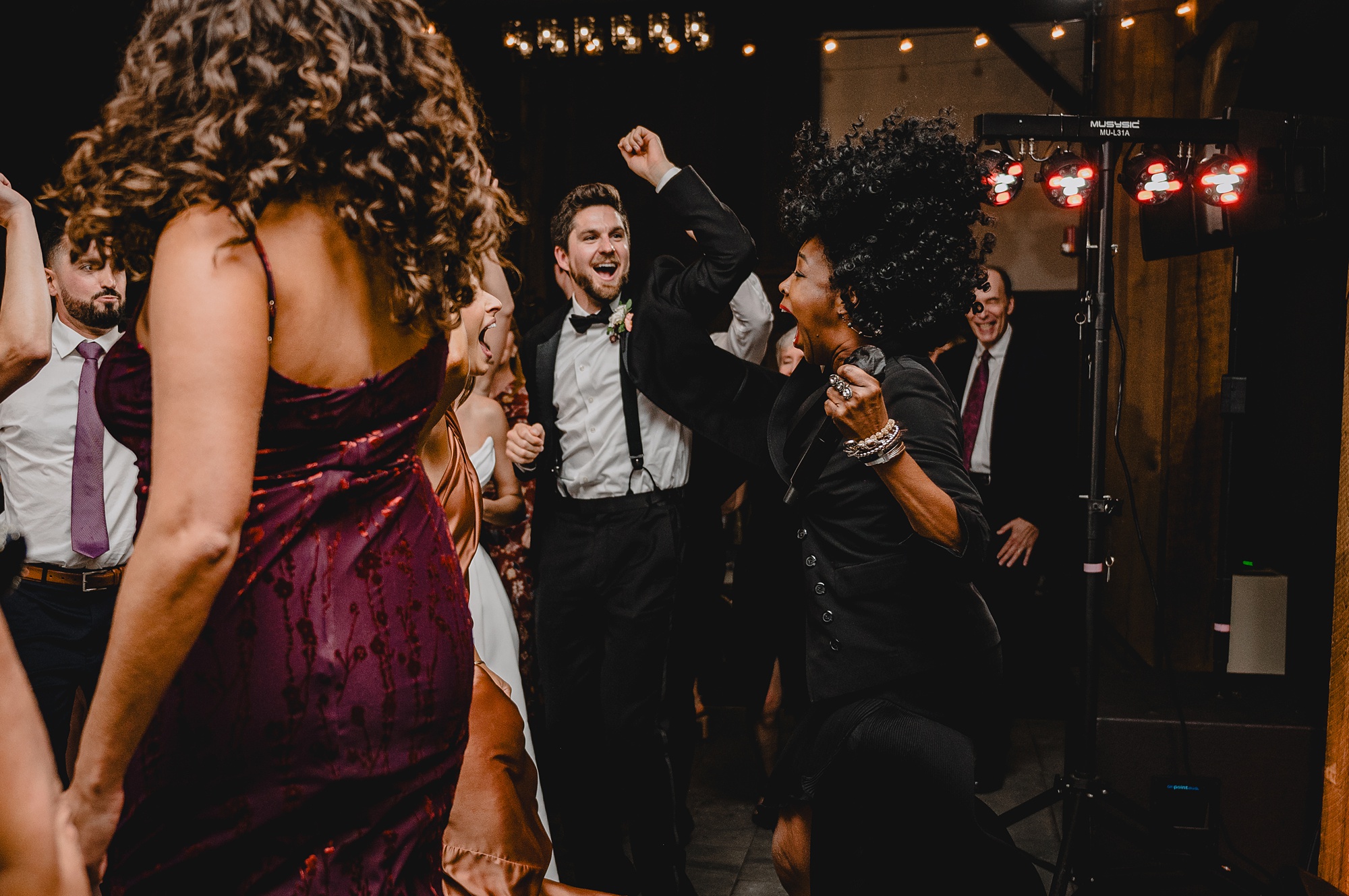 groom cheers fist pumping on dance floor at Waterloo Village