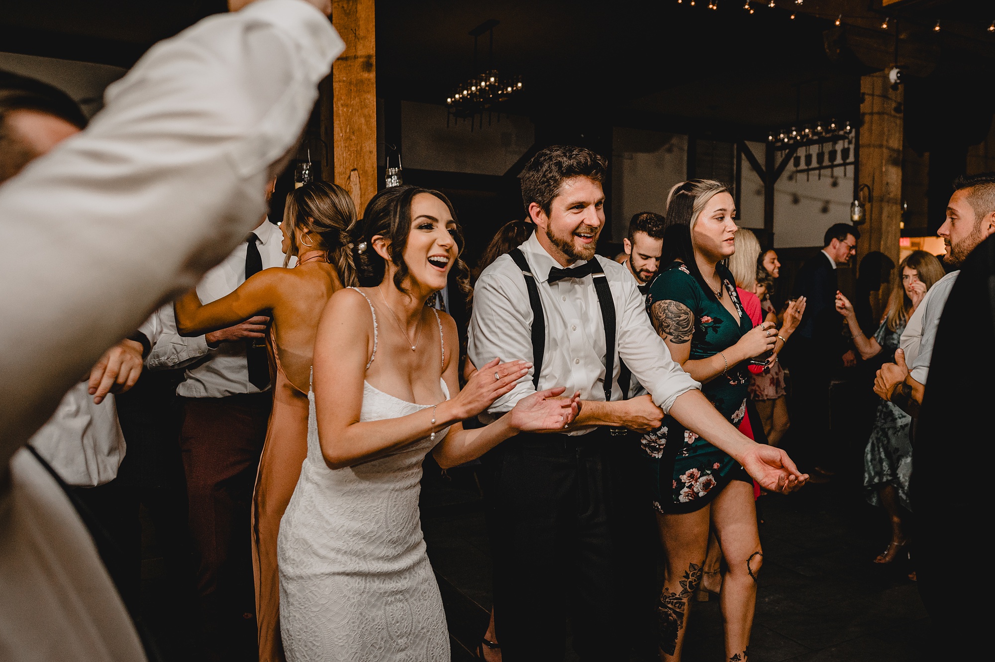 newlyweds dance with guests during NJ wedding reception 