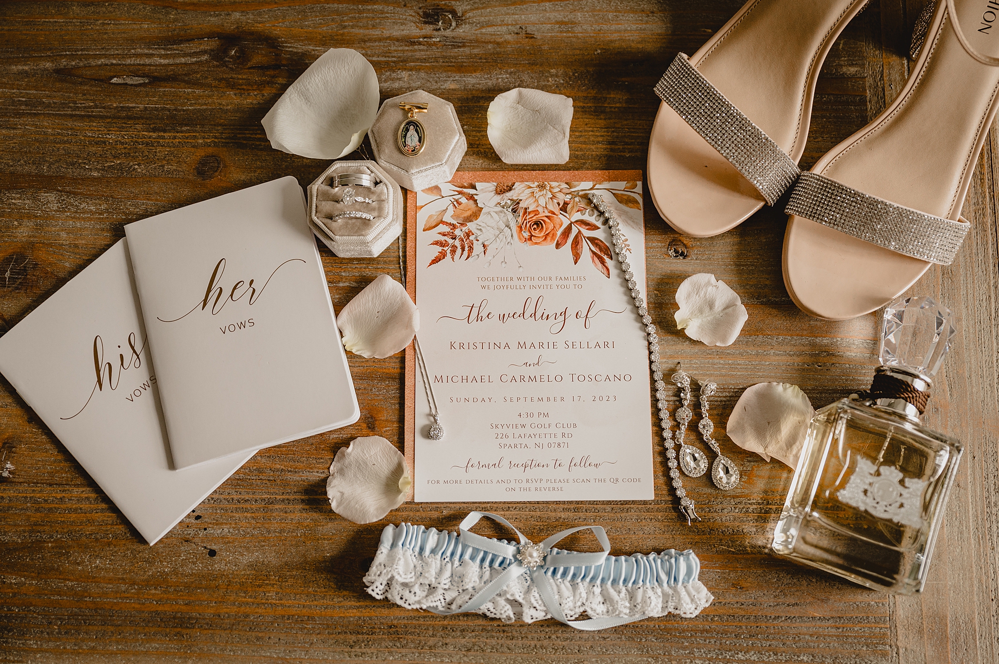 fall invitation suite with bride's shoes and vow booklet