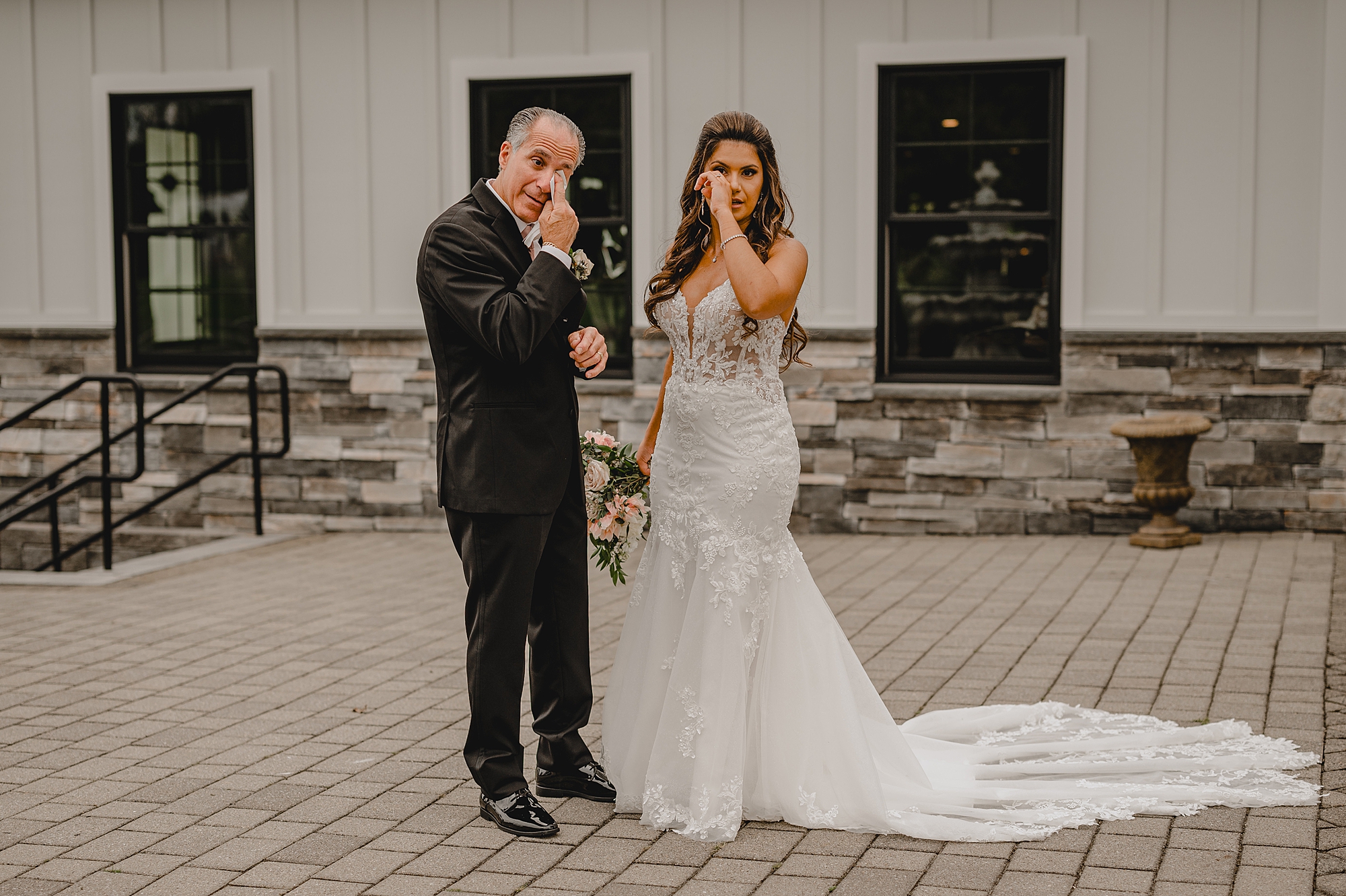 bride and father wipe eyes during first look outside Skyview Golf Club